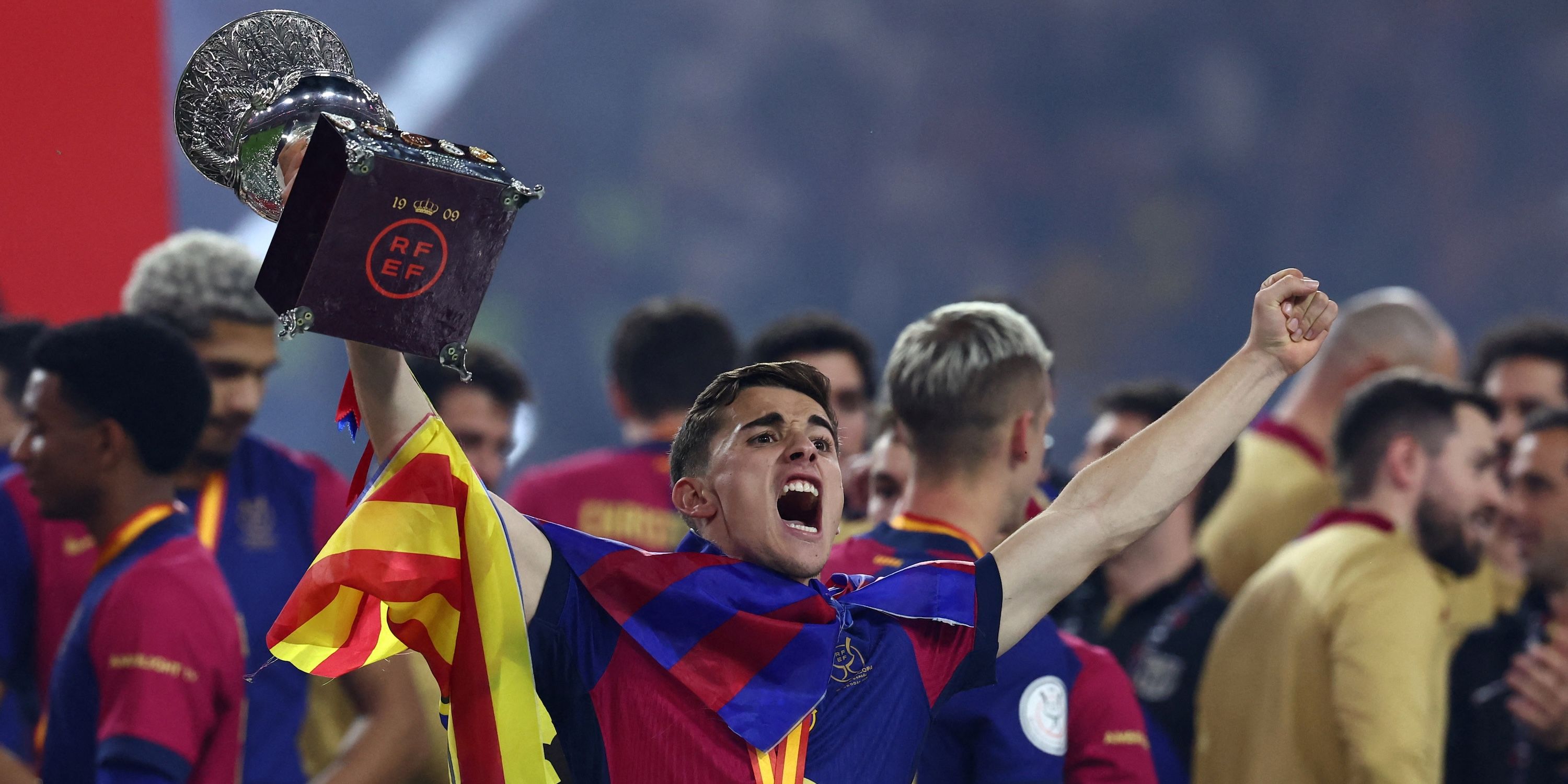 Barcelona's Gavi lifts the trophy as he celebrates winning the Spanish Super Cup