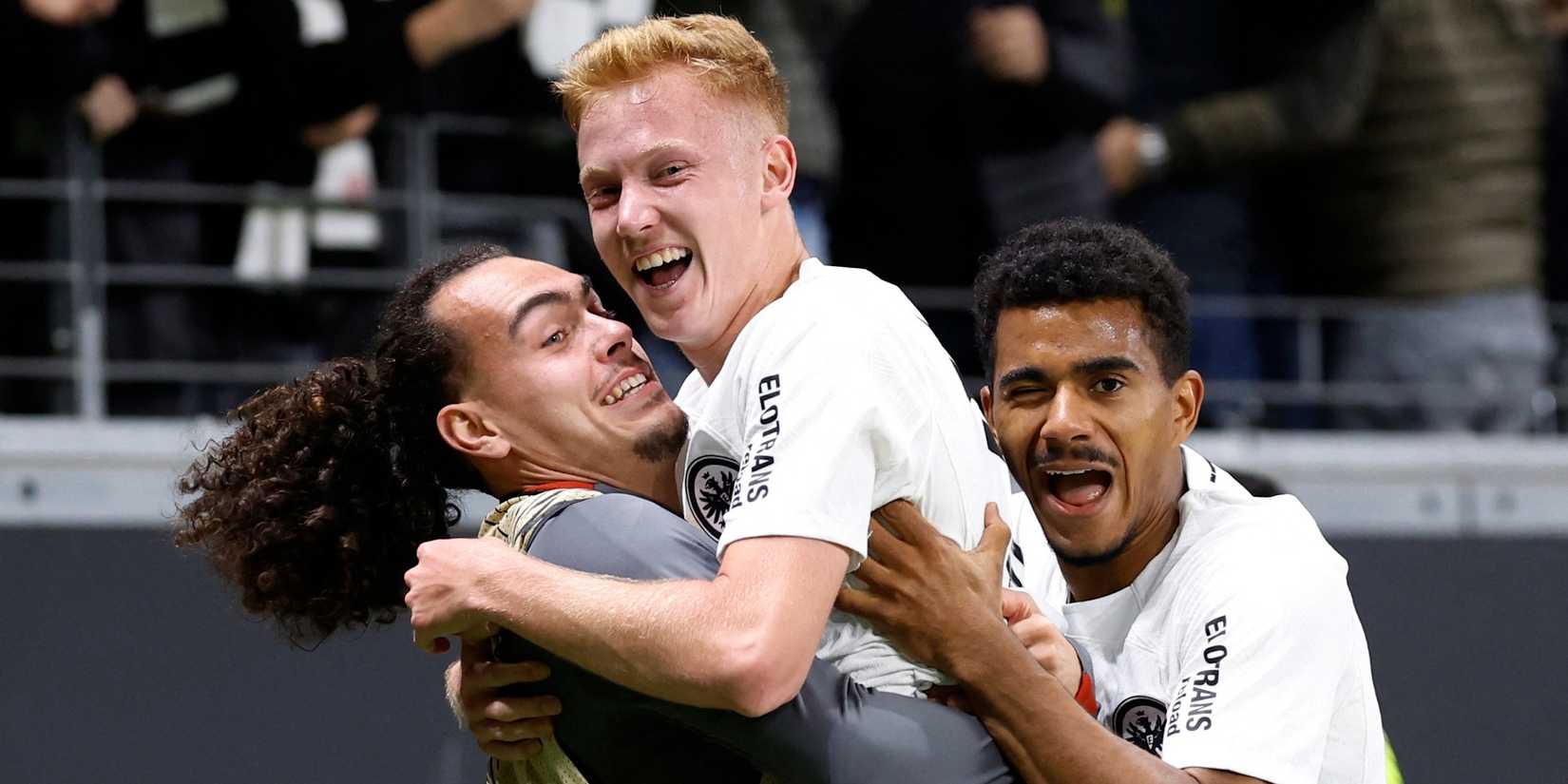 Eintracht Frankfurt's Hugo Larsson celebrates scoring their first goal with Ansgar Knauff and Arthur Theate