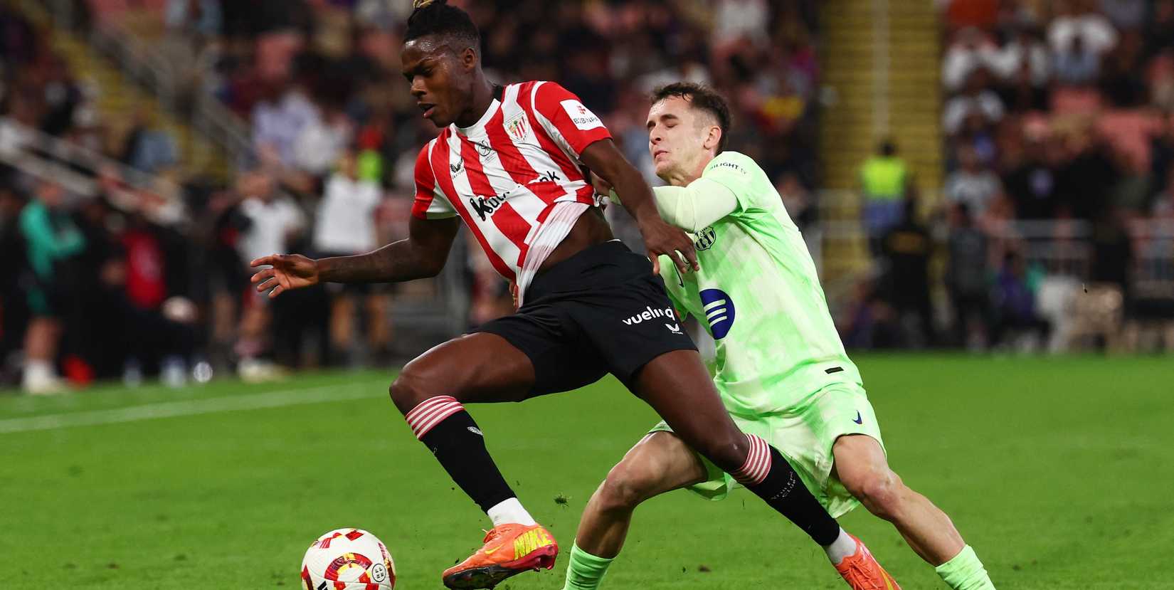 FC Barcelona's Marc Casado in action with Athletic Bilbao's Nico Williams