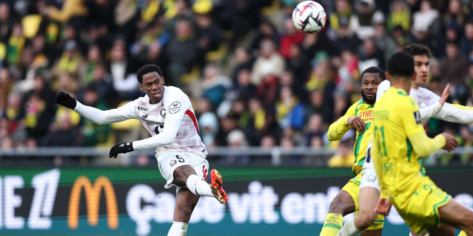 Lille's Jonathan David shoots at goal 