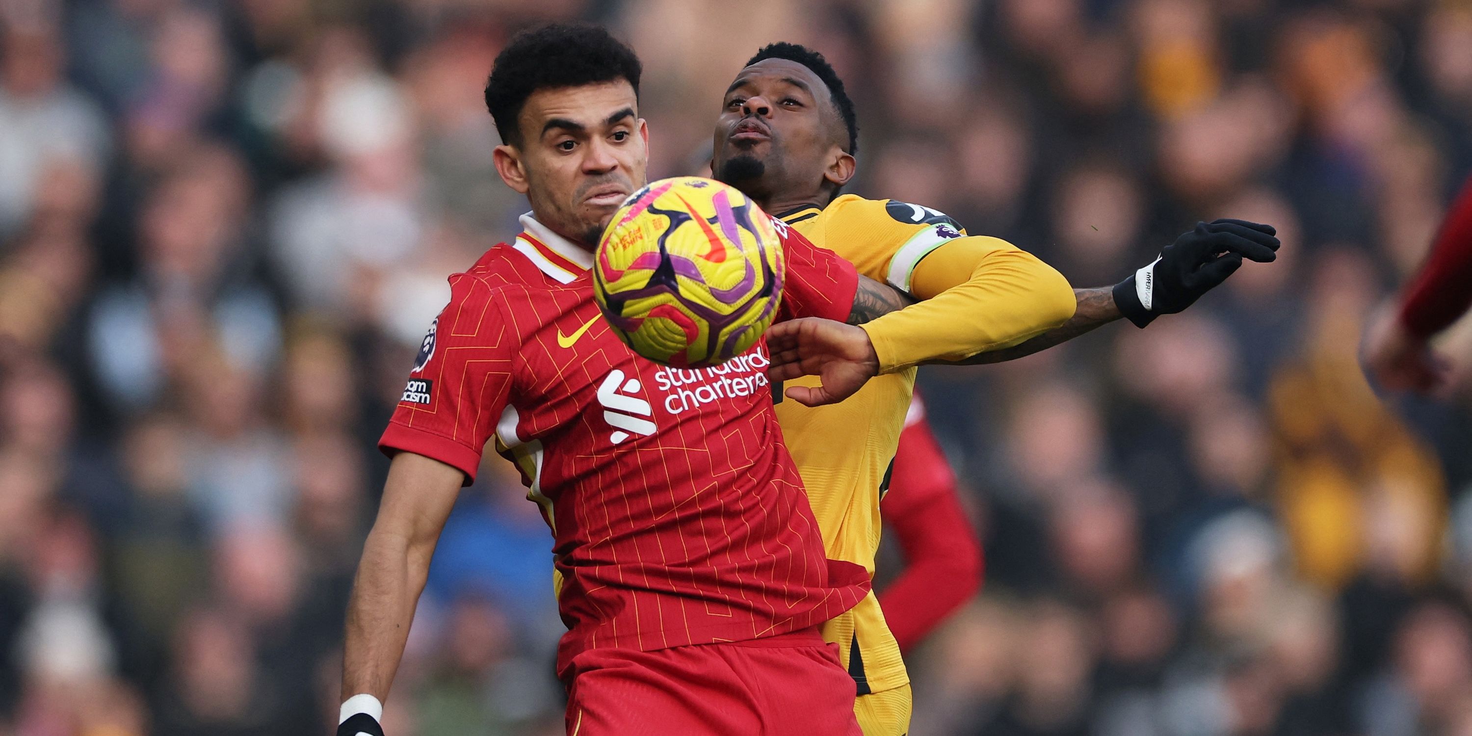 Liverpool's Luis Diaz in action with Wolverhampton Wanderers' Nelson Semedo