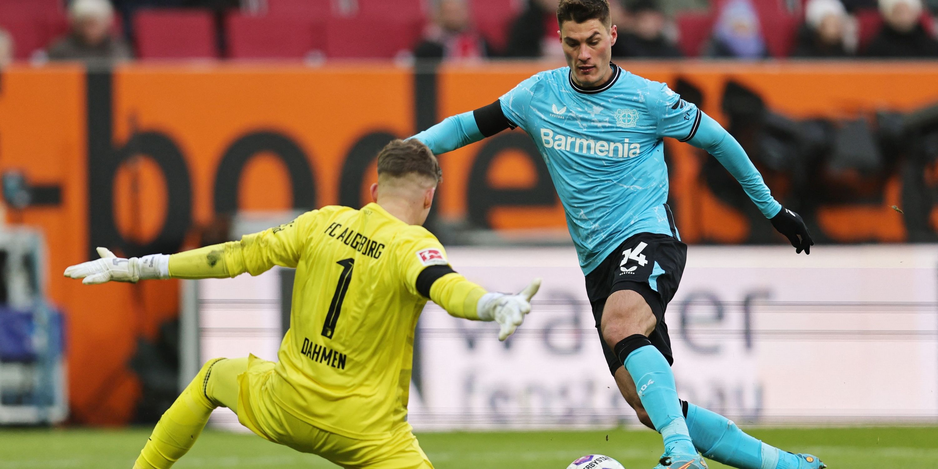Patrick Chic from Bayer Leverkusen with Fin Dahmen from FC Augsburg