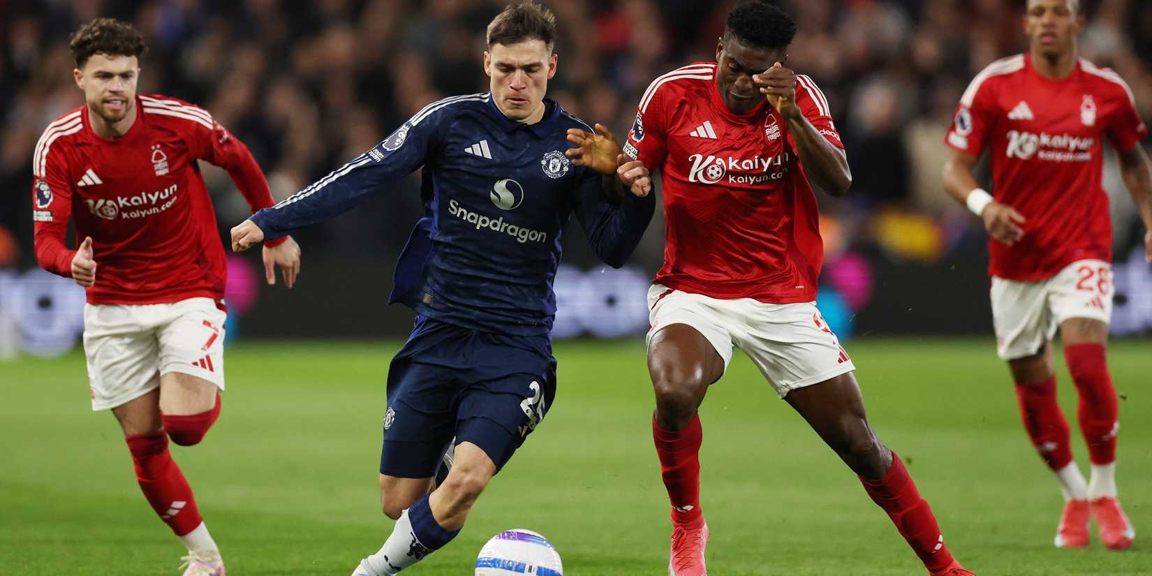 Manuel Ugarte in action by Manchester United with Taiwo Awoniyi from Nottingham Forest 