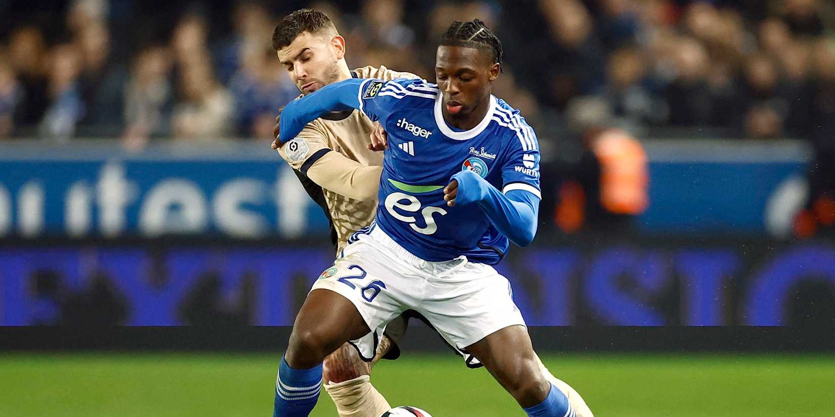 Lucas Hernandez of Paris Saint -Germain with Dylan Backoa from RC StraSbourg