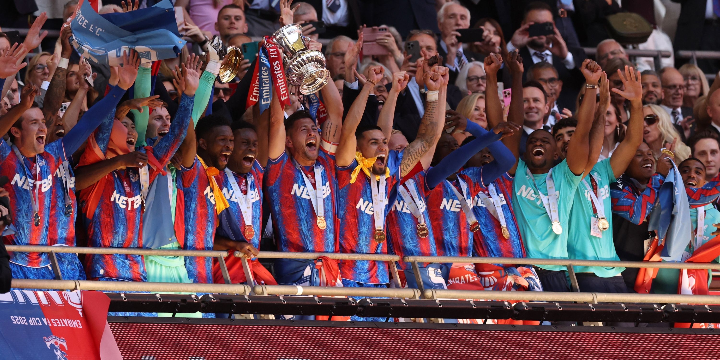 Joel Ward from Crystal Palace and Mark Joy celebrates the cup after winning the FA Cup