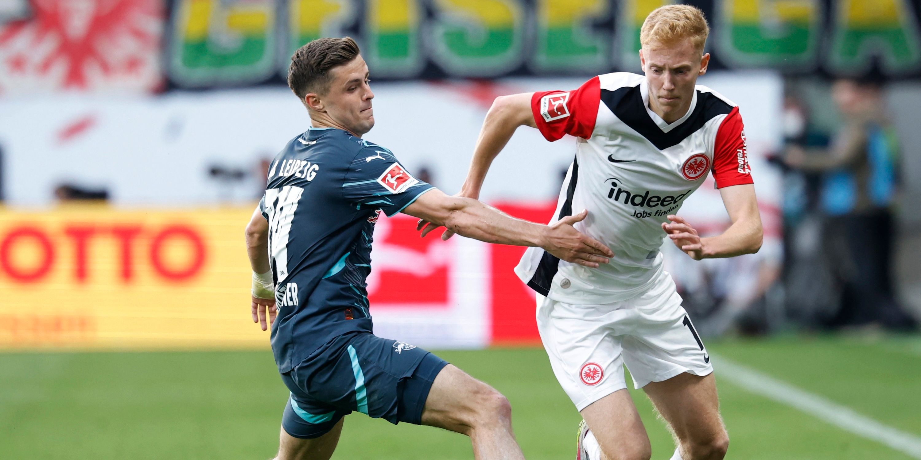 Hugo Larson from Eintracht Frankfurt with Christophe Bumgartner of RB Leipzig
