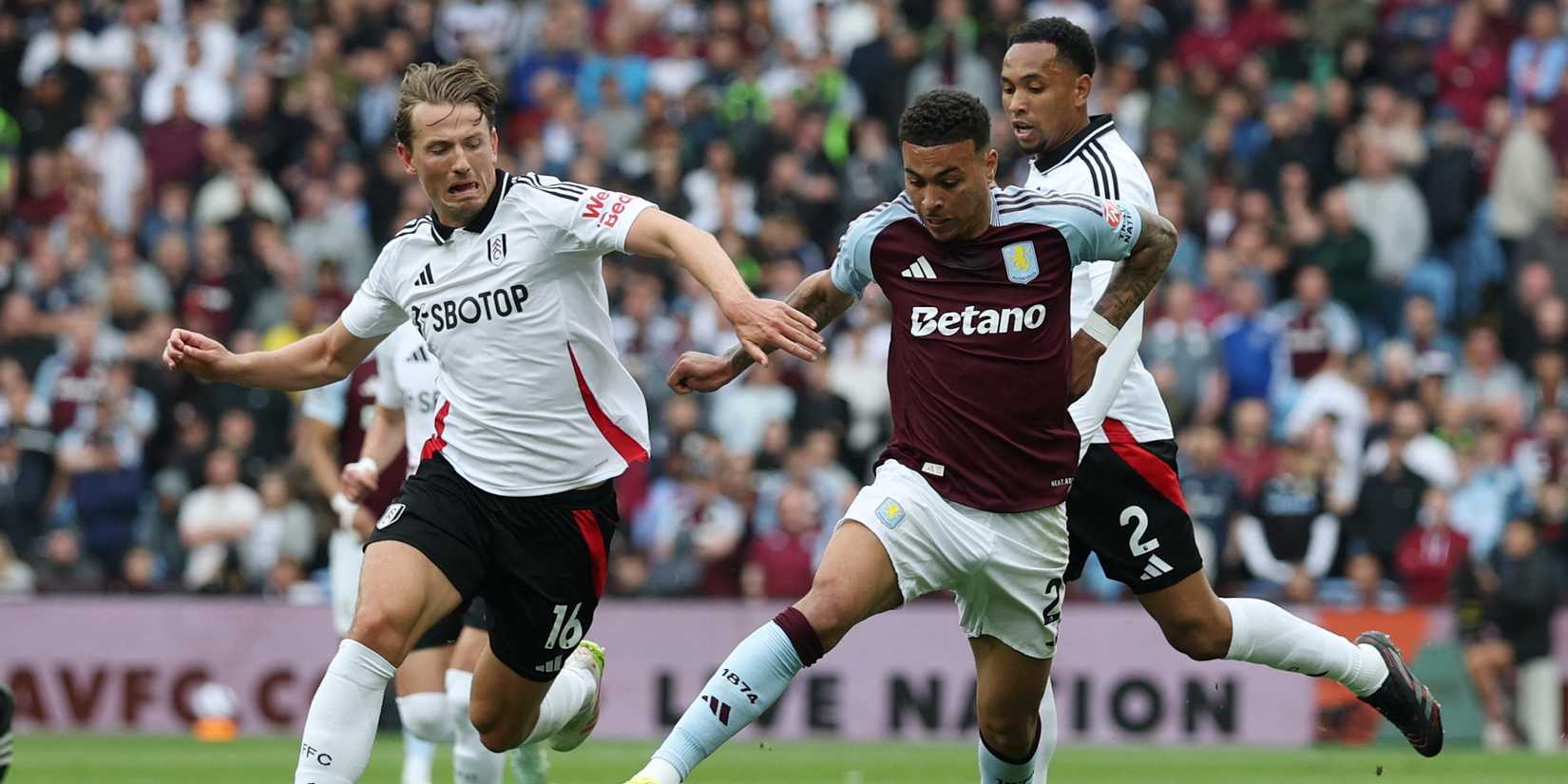Fulham's Sander Berge in action with Aston Villa's Morgan Rogers