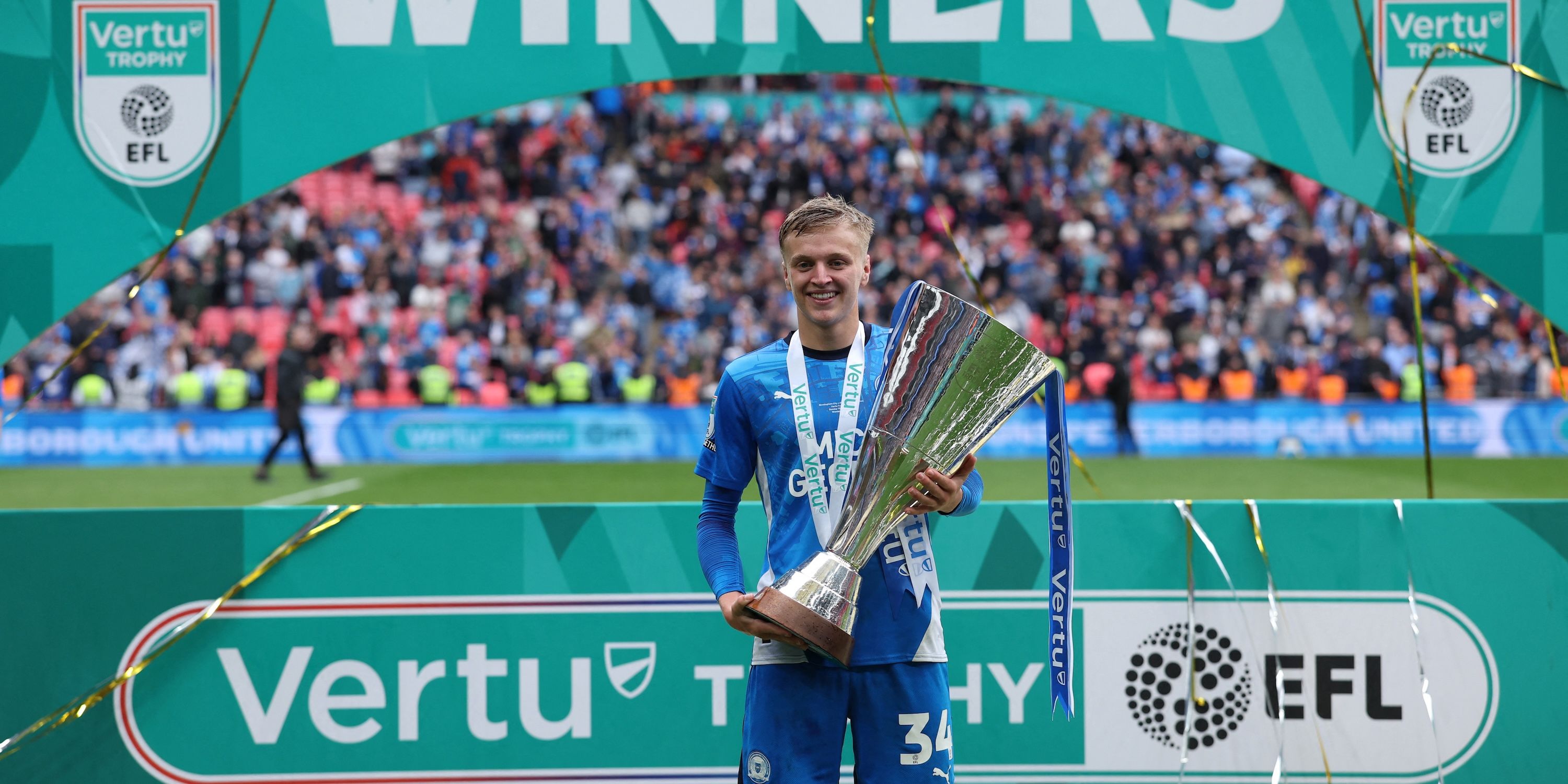 Peterborough's Harley Mills celebrates after winning EFL trophy