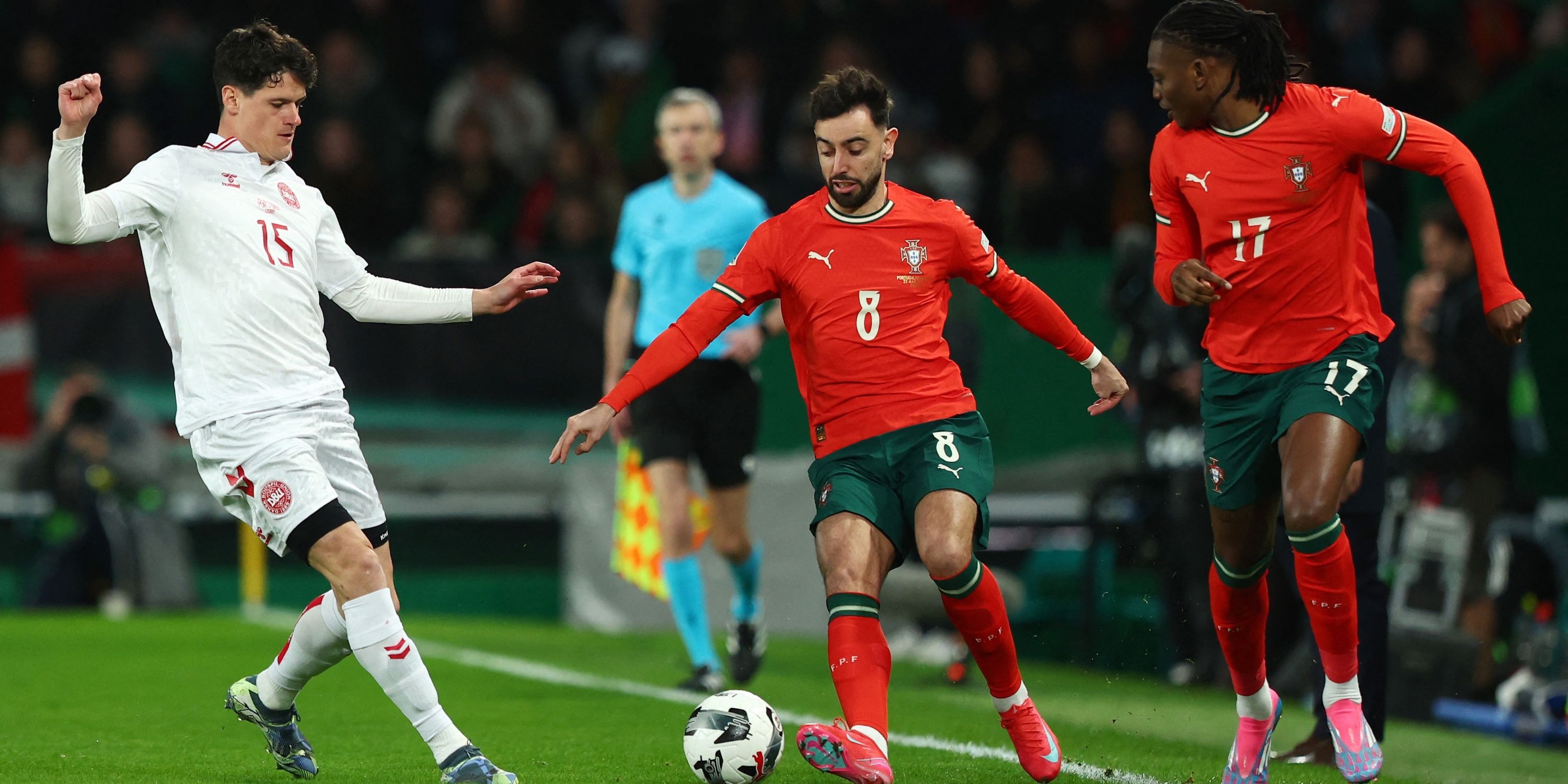 Bruno Fernandes of Portugal is moving with the Christian Norgaard and Portuguese Rafael Leao 