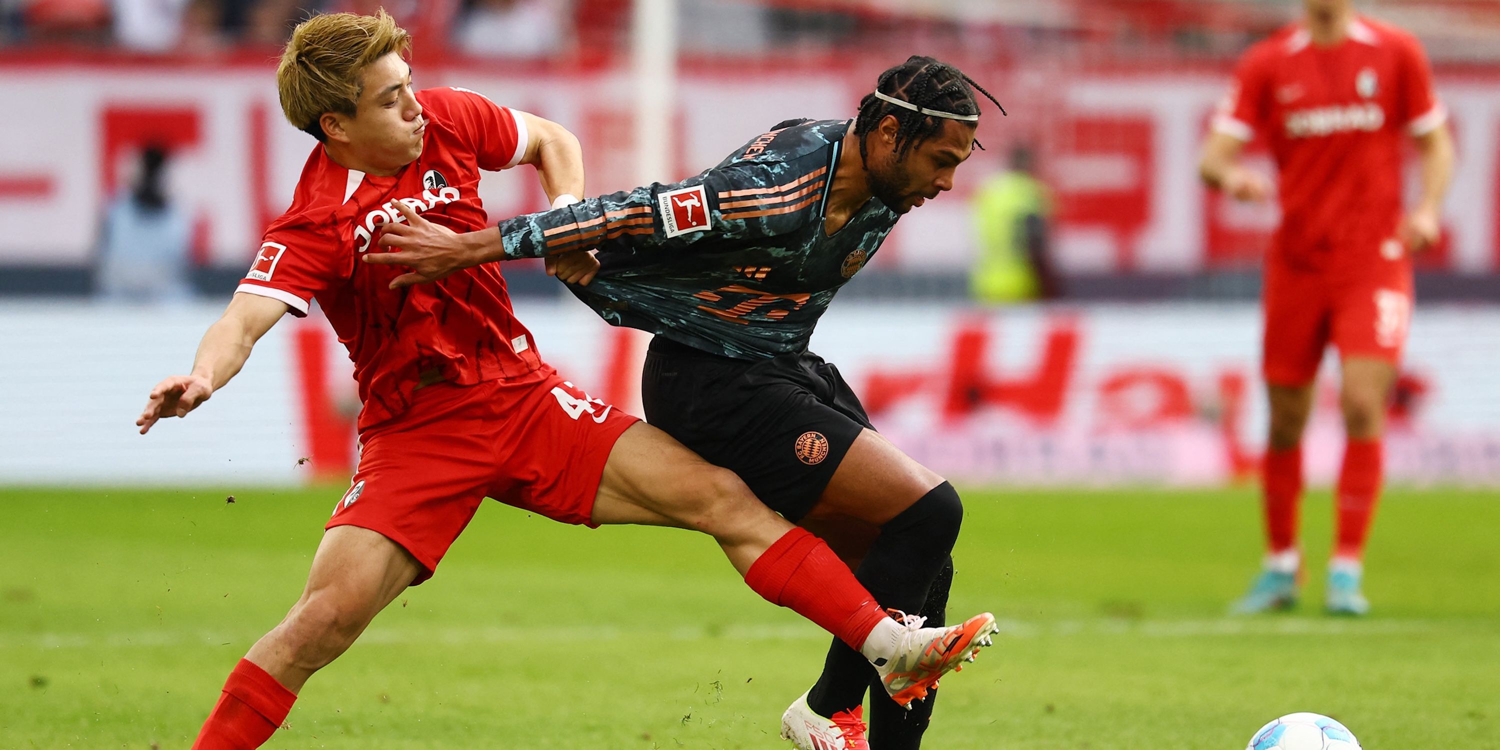  SC Freiburg's Ritsu Doan in action with Bayern Munich's Serge Gnabry 
