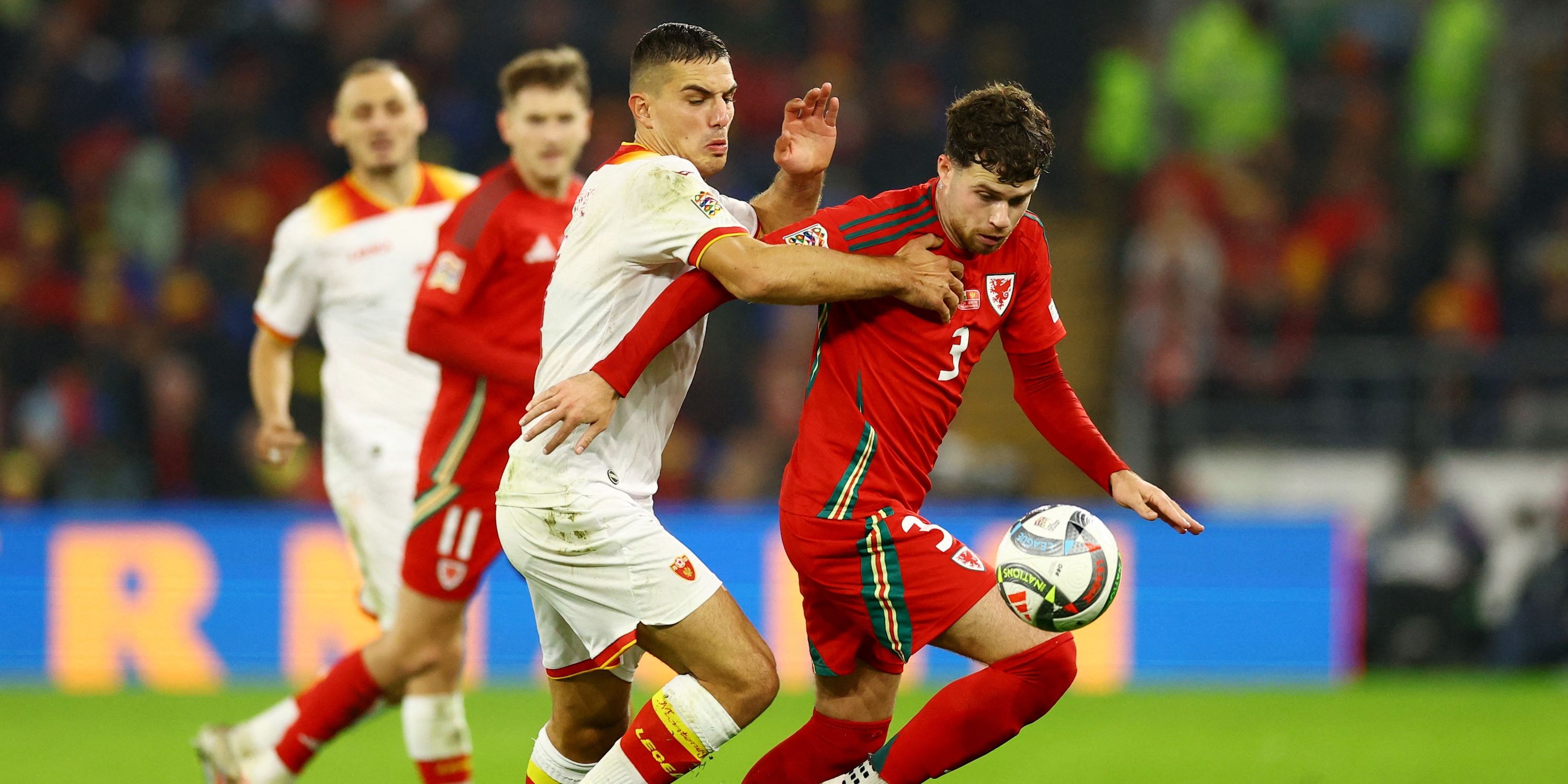 Neco Williams of Wales acts with Nikola Krstovic of Montenegro
