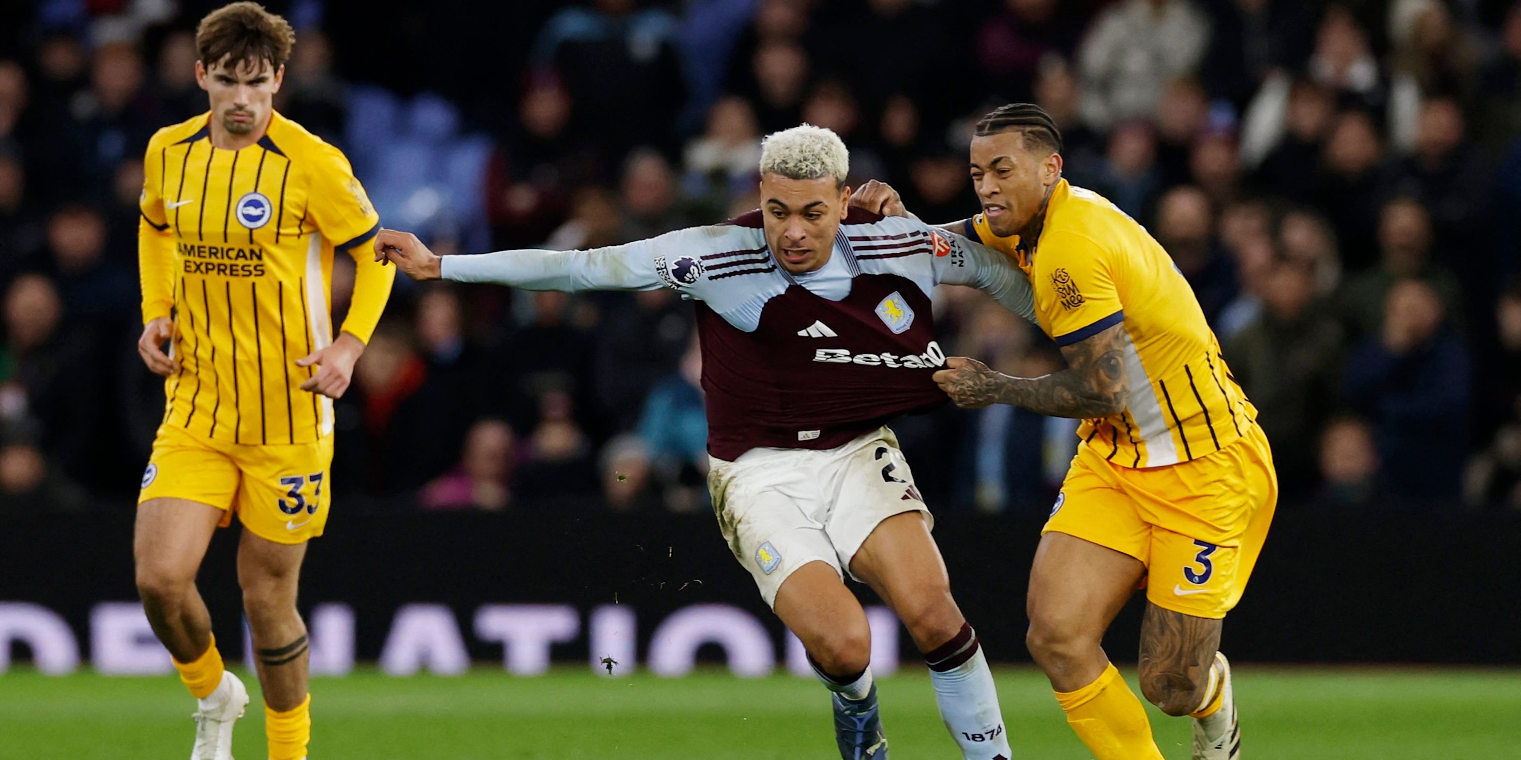 Aston Villa's Morgan Rogers in action with Brighton & Hove Albion's Igor Julio