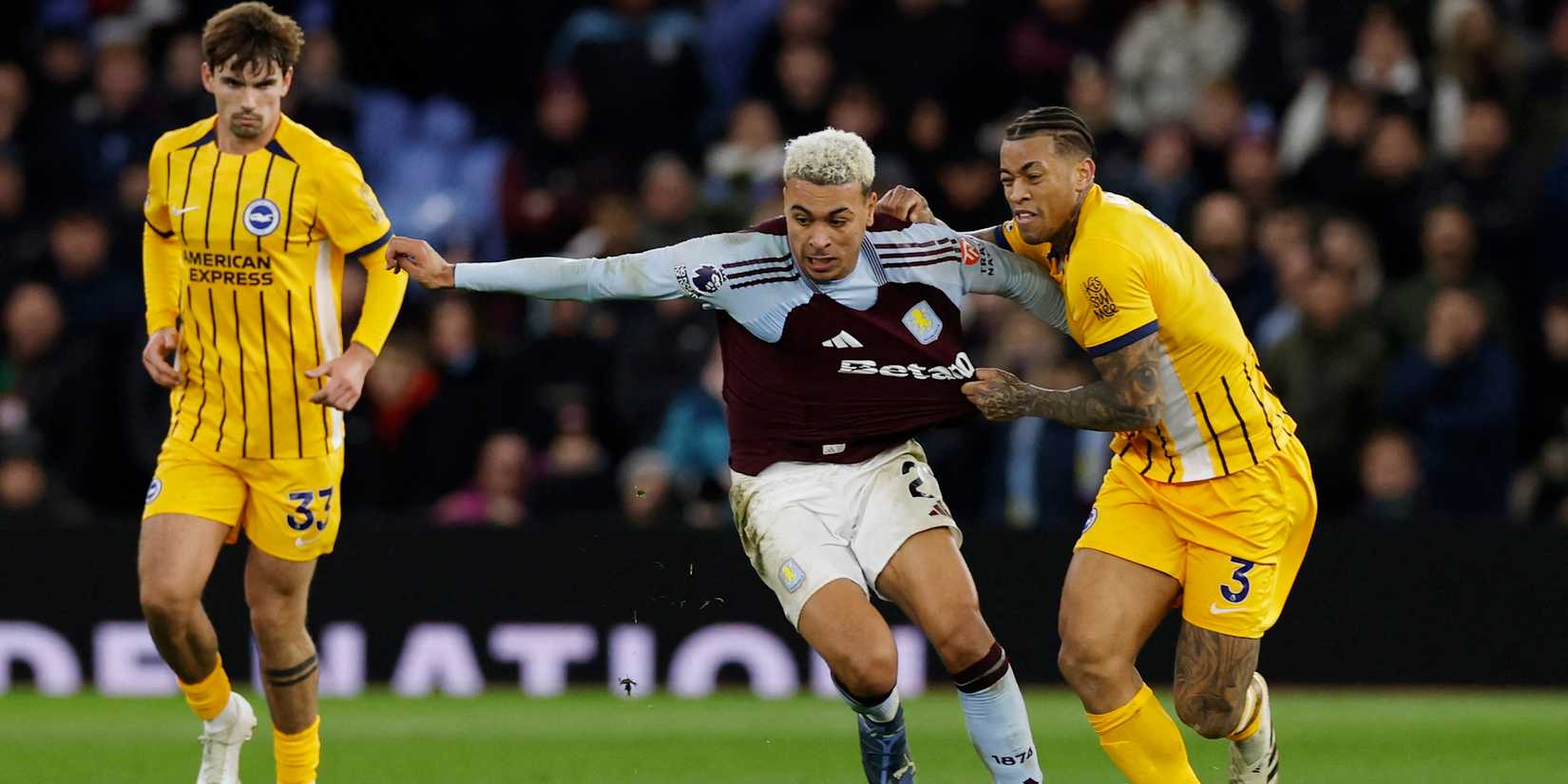 Aston Villa's Morgan Rogers in action with Brighton & Hove Albion's Igor Julio