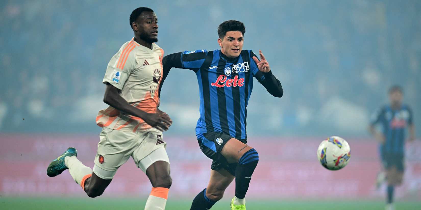 Atalanta's Raoul Bellanova in action with AS Roma's Evan Ndicka