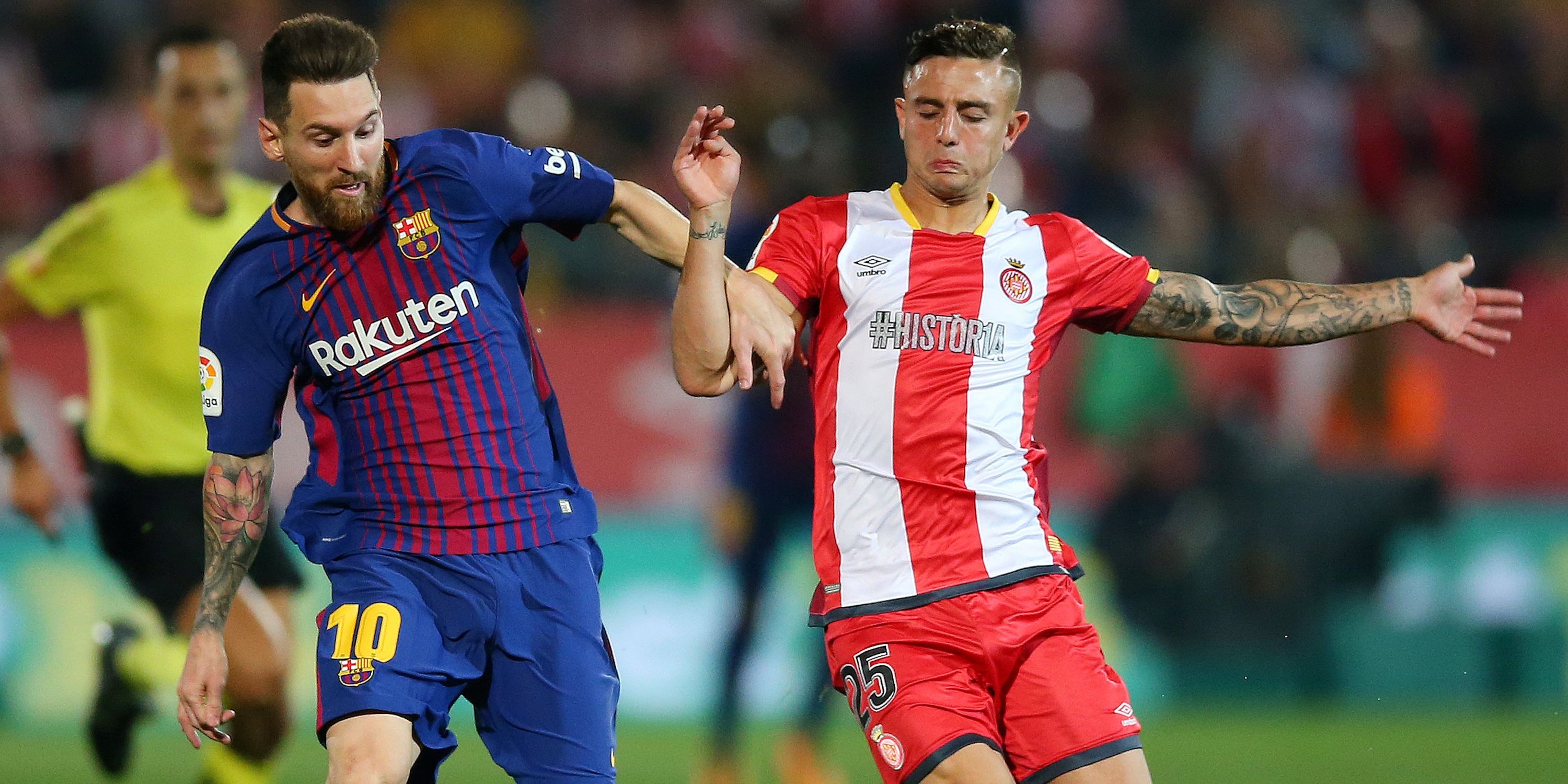 Lionel Messi of Barcelona in action with Pablo Maffo de Gérona