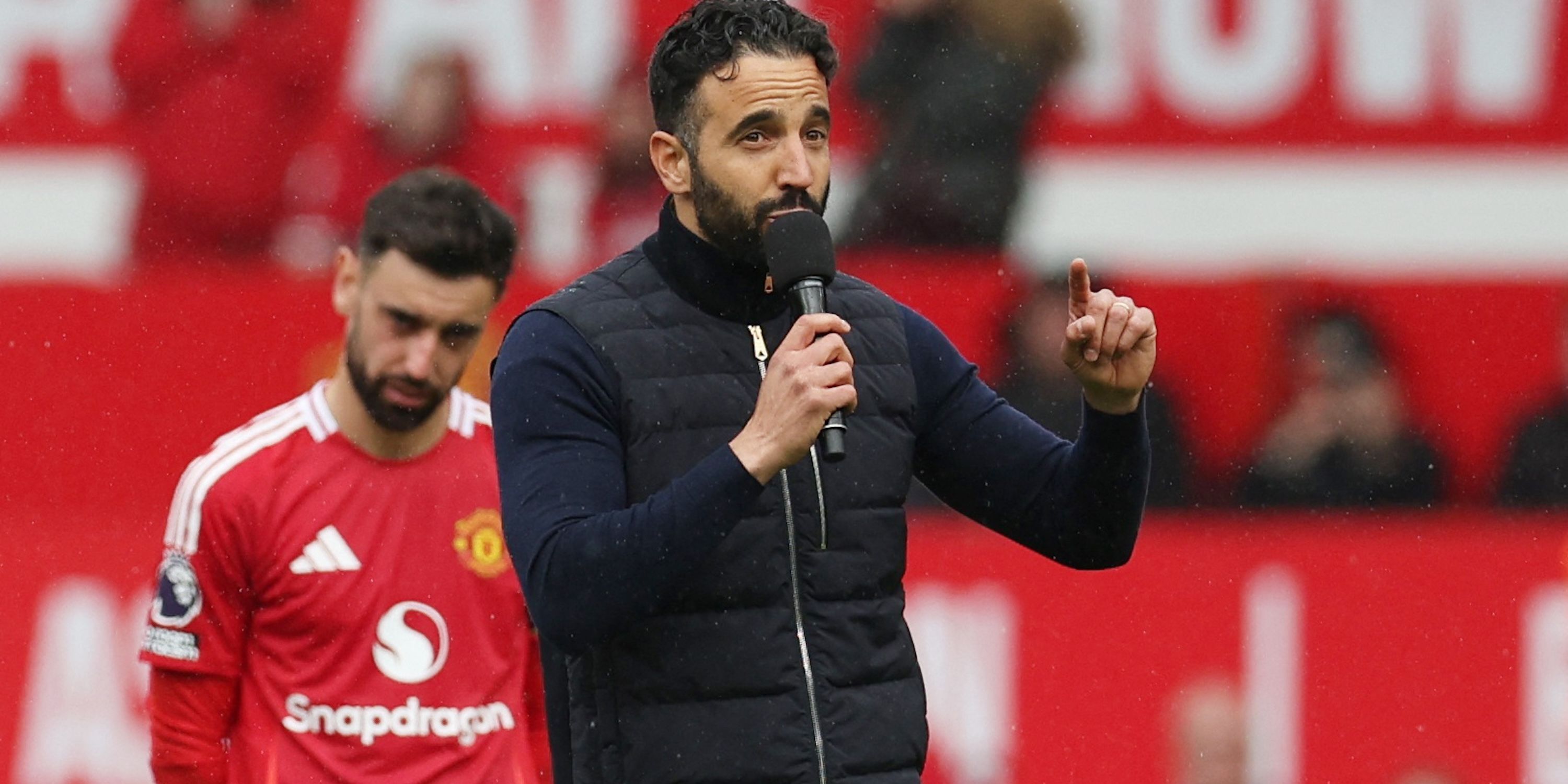Manchester United manager Ruben Amorim talks to fans after the match