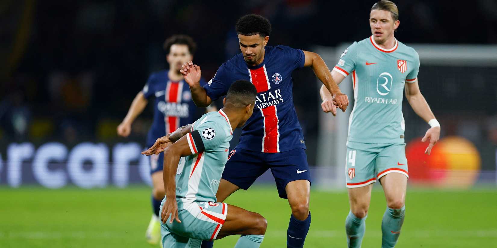 Paris St Germain's Warren Zaire-Emery in action with Atletico Madrid's Reinildo Mandava
