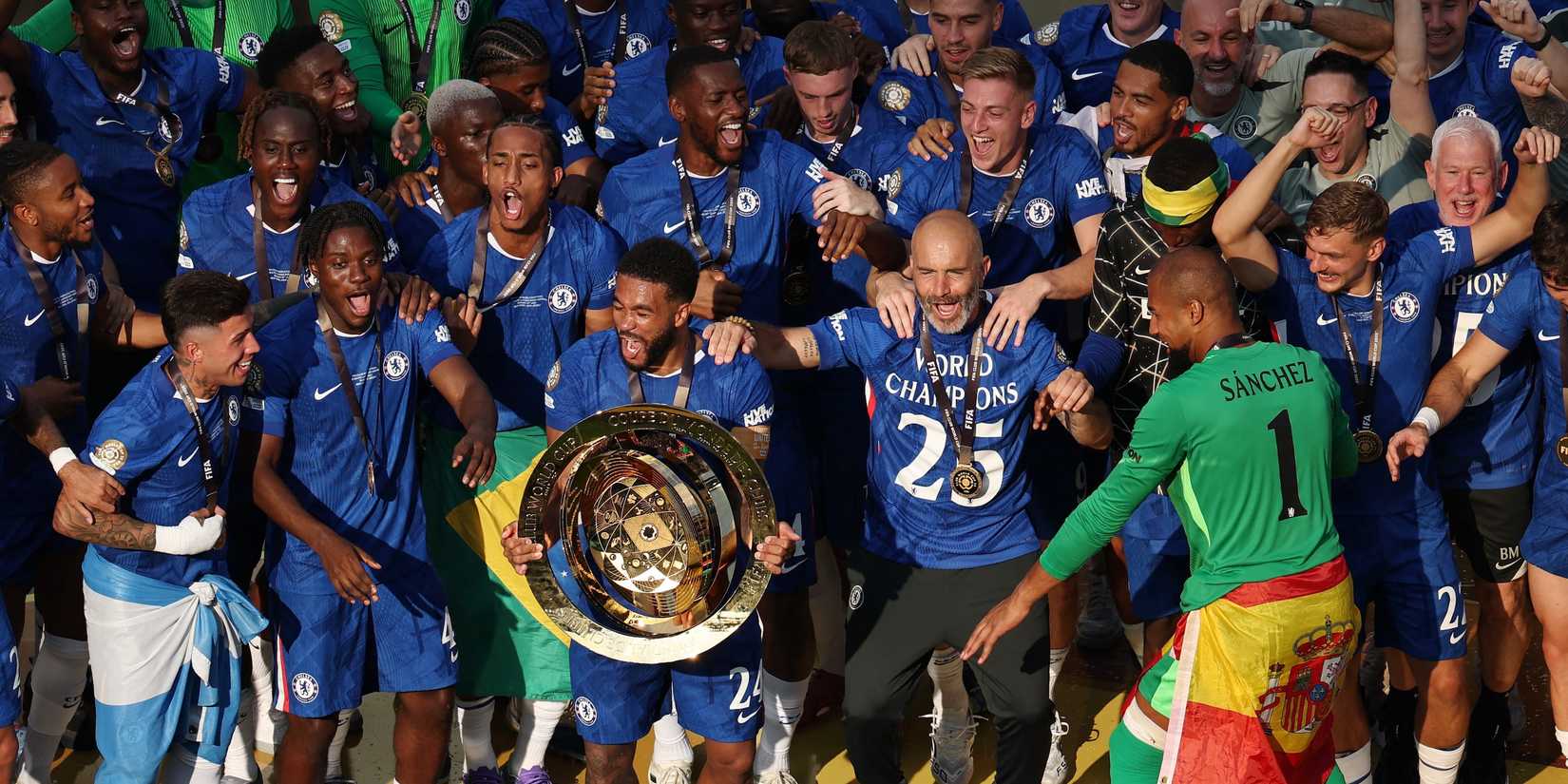 Chelsea's Reece James lifts the trophy as he celebrates with Chelsea manager Enzo Maresca and teammates after winning the FIFA Club World Cup
