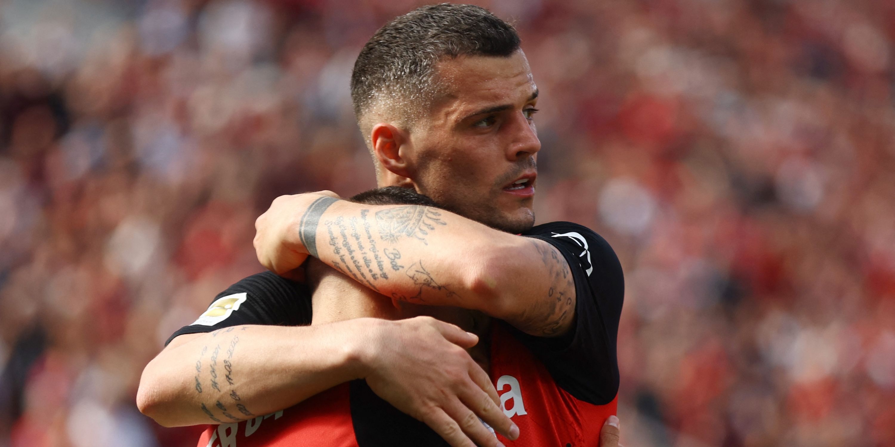 Bayer Leverkusen's Emiliano Buendia, emphasized the second goal with Granit Xhaka