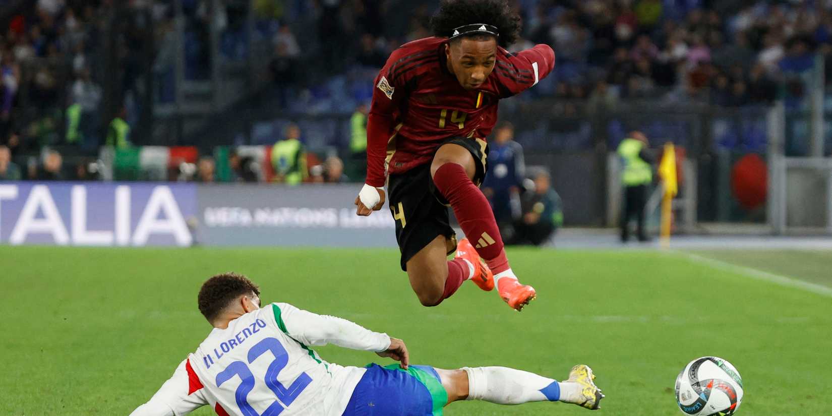 Belgium's Malick Fofana in action with Italy's Giovanni Di Lorenzo