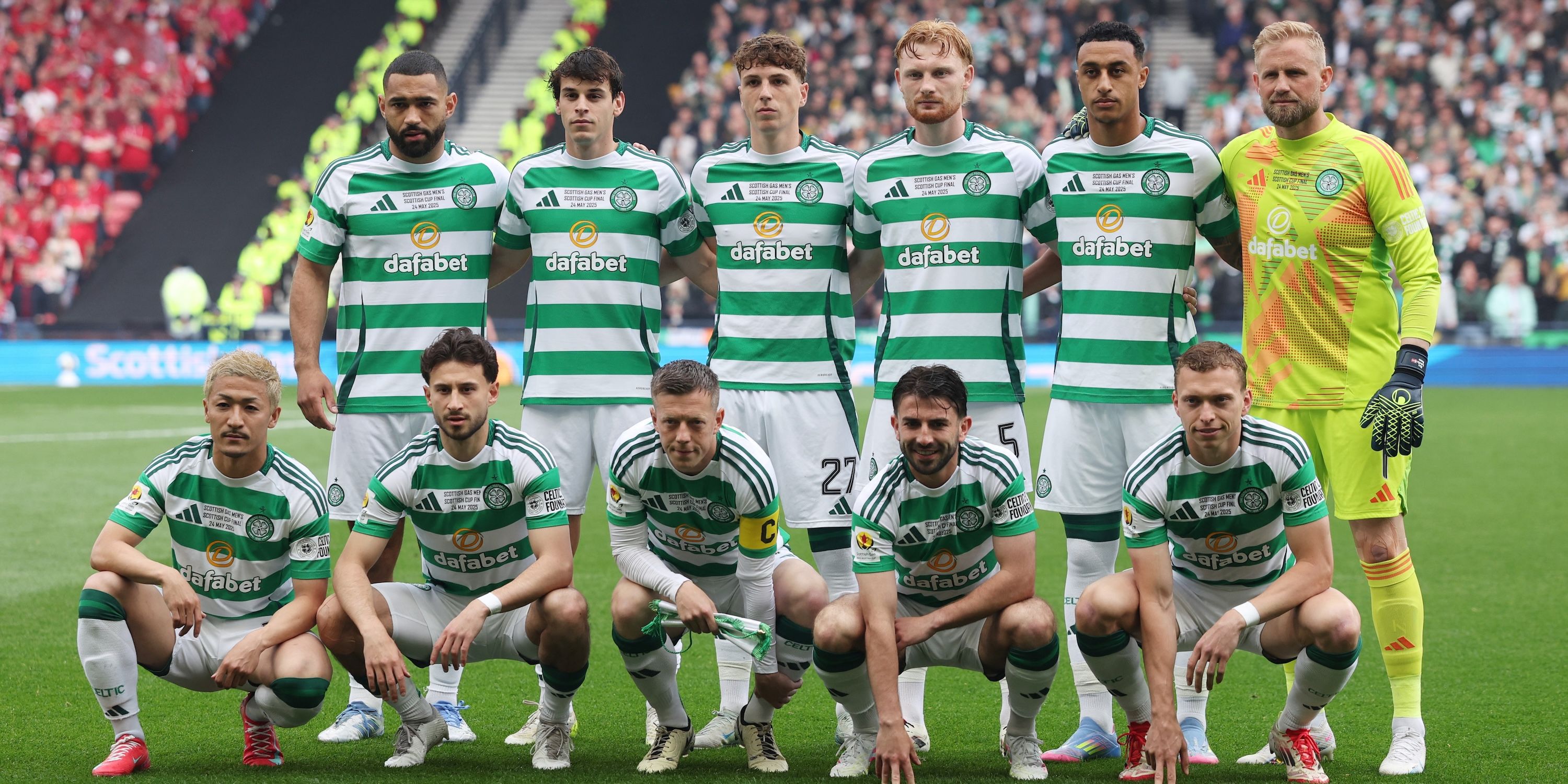 Celtic players raise the group group photo before the match