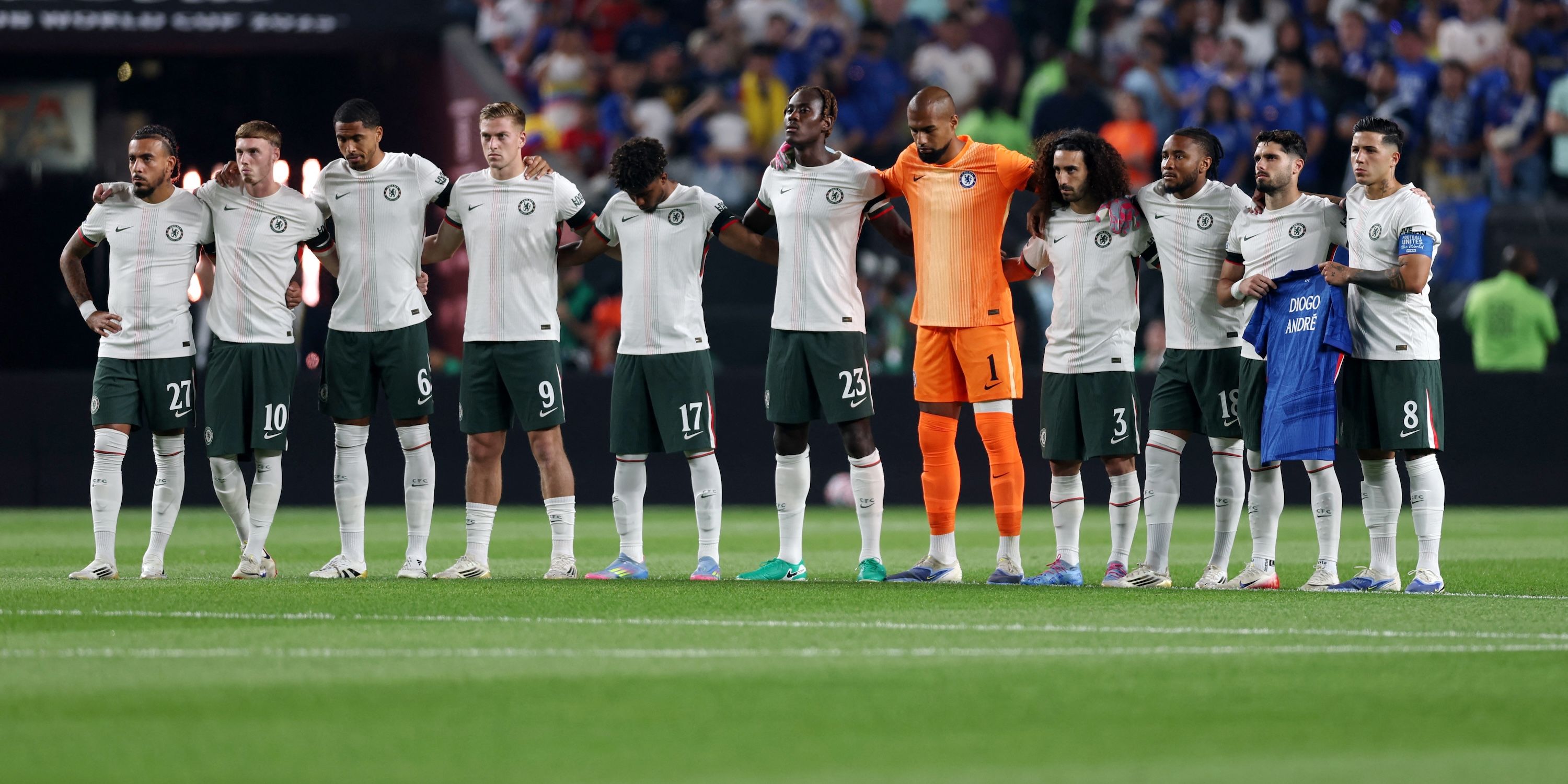 Chelsea players stand for a minutes silence in tribute to Liverpool's Diogo Jota and his brother Andre Silva before the match-1