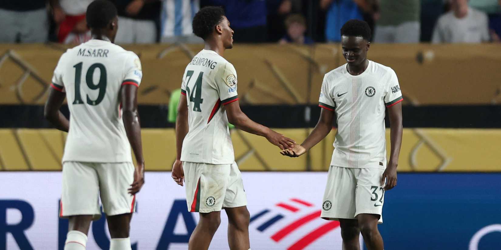 Tyrique George de Chelsea celebrates the note of their third goal with Josh Acheambong