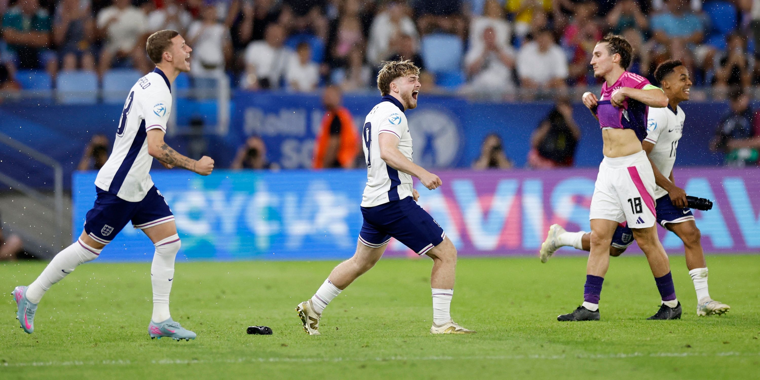 England's Harvey Elliott and England's Jay Stansfield celebrate after the match as Germany's Rocco Reitz looks dejected
