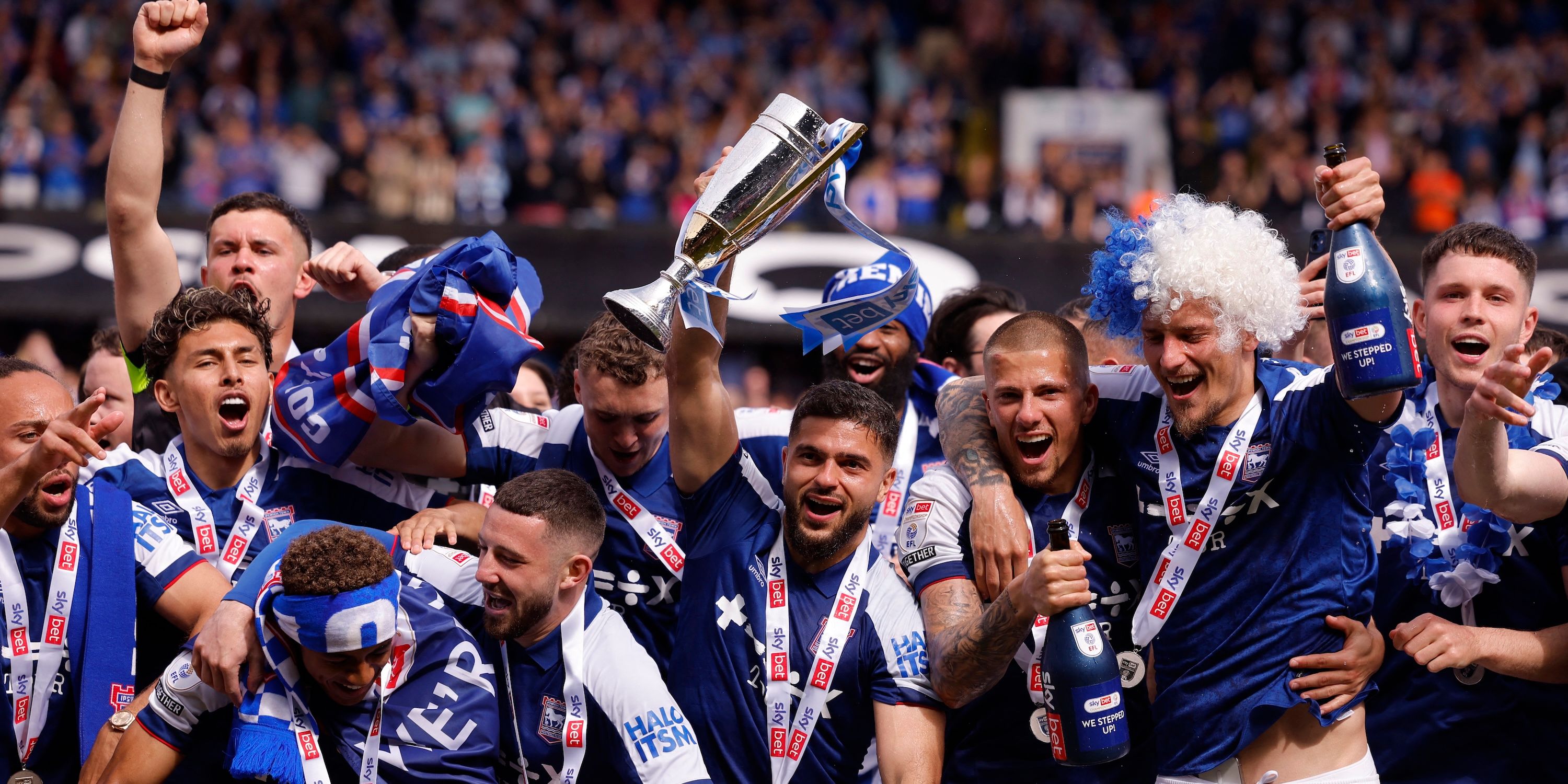 The players of the city of Ipswich celebrate with a trophy and a promotion at the Premier League