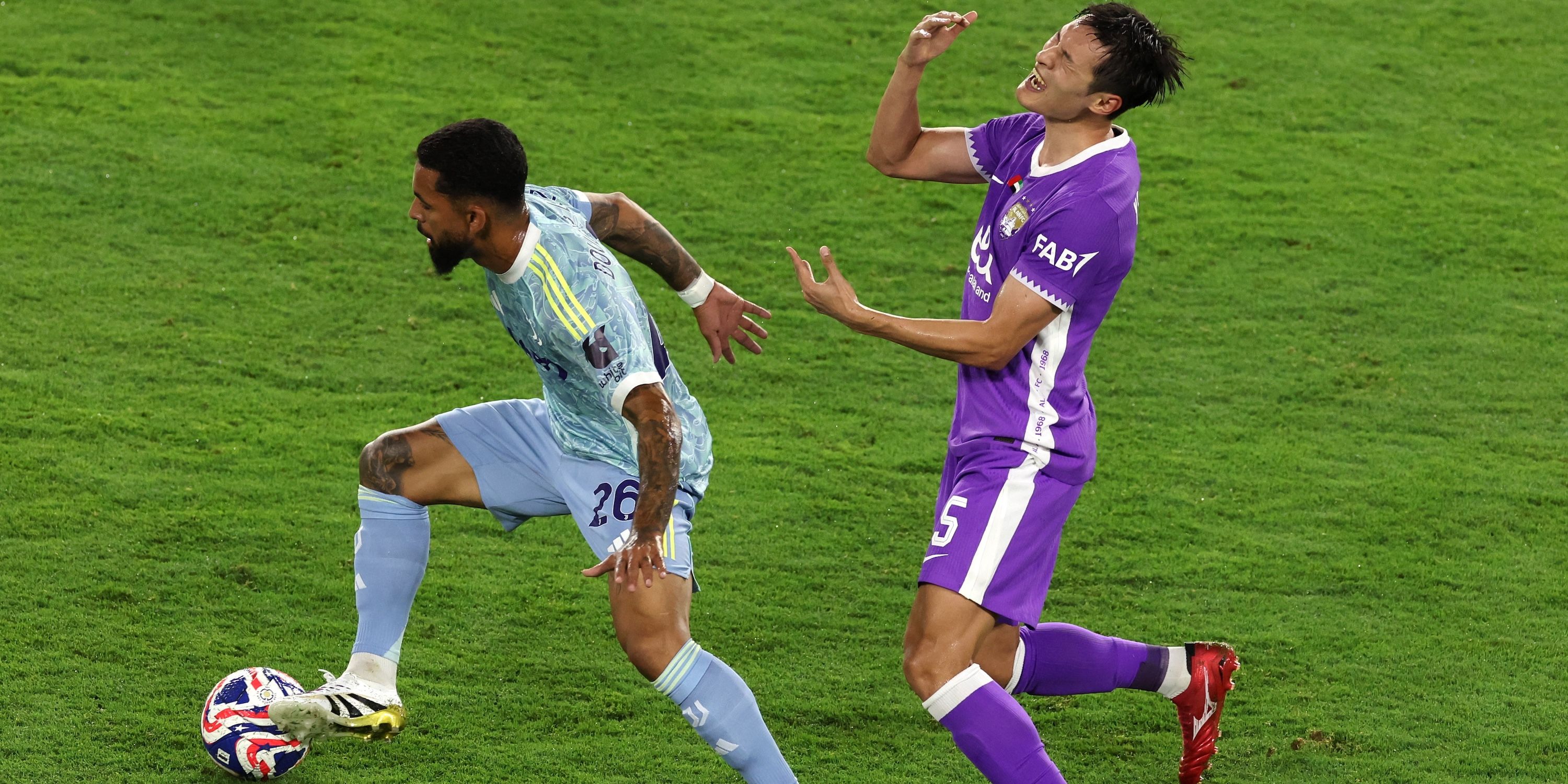 Juventus' Douglas Luiz in action with Al Ain's Park Yong-woo 