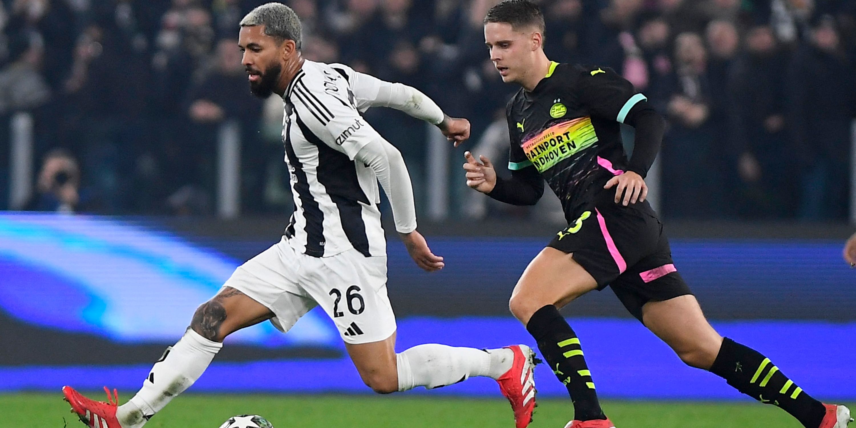  Juventus' Douglas Luiz in action with PSV Eindhoven's Joey Veerman