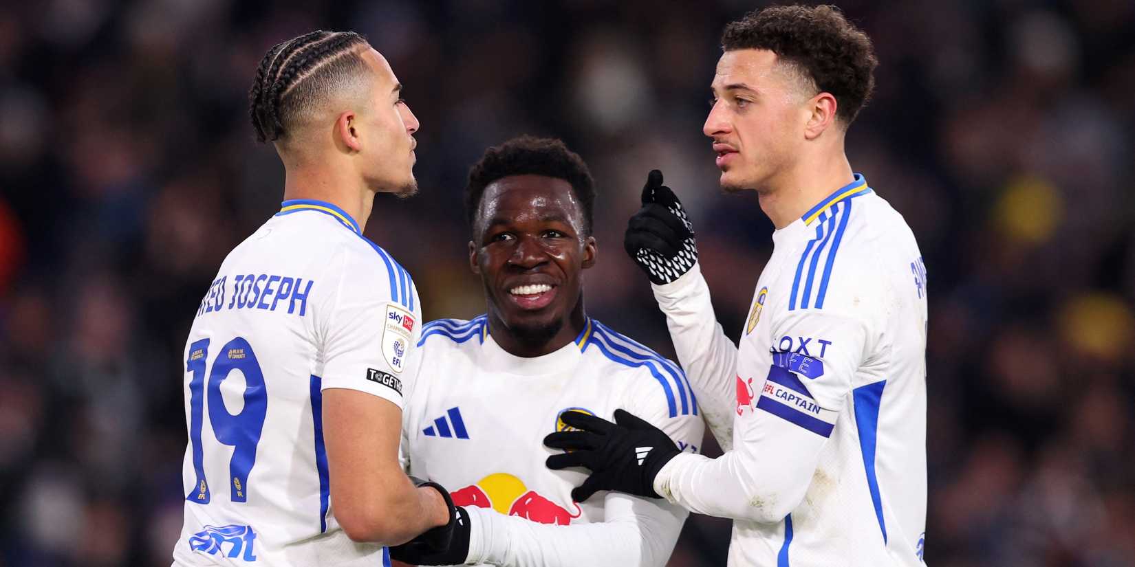 Leeds United player Mathieu Joseph celebrates with Ethan Ampadu and Wilfried Junto