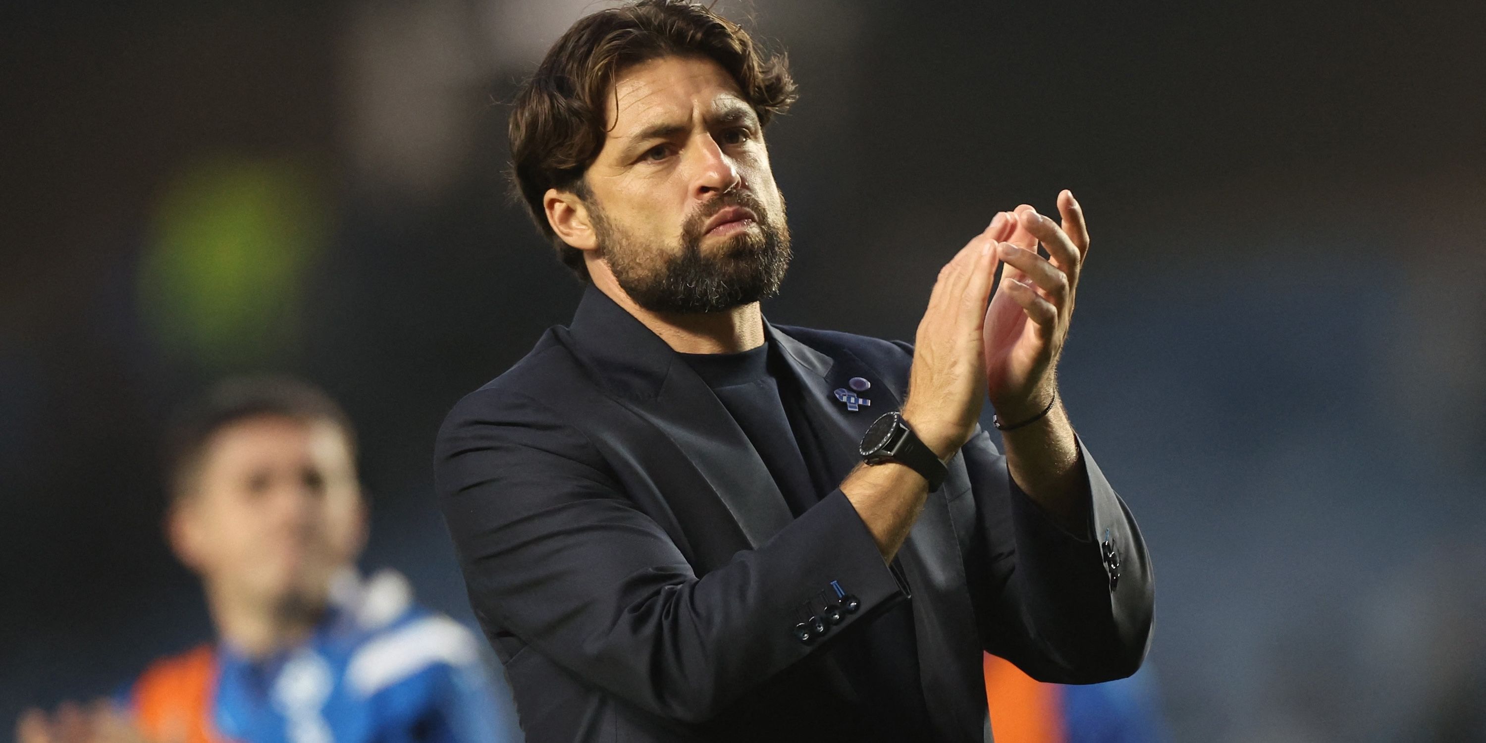 Rangers manager Russell Martin applauds fans after the match