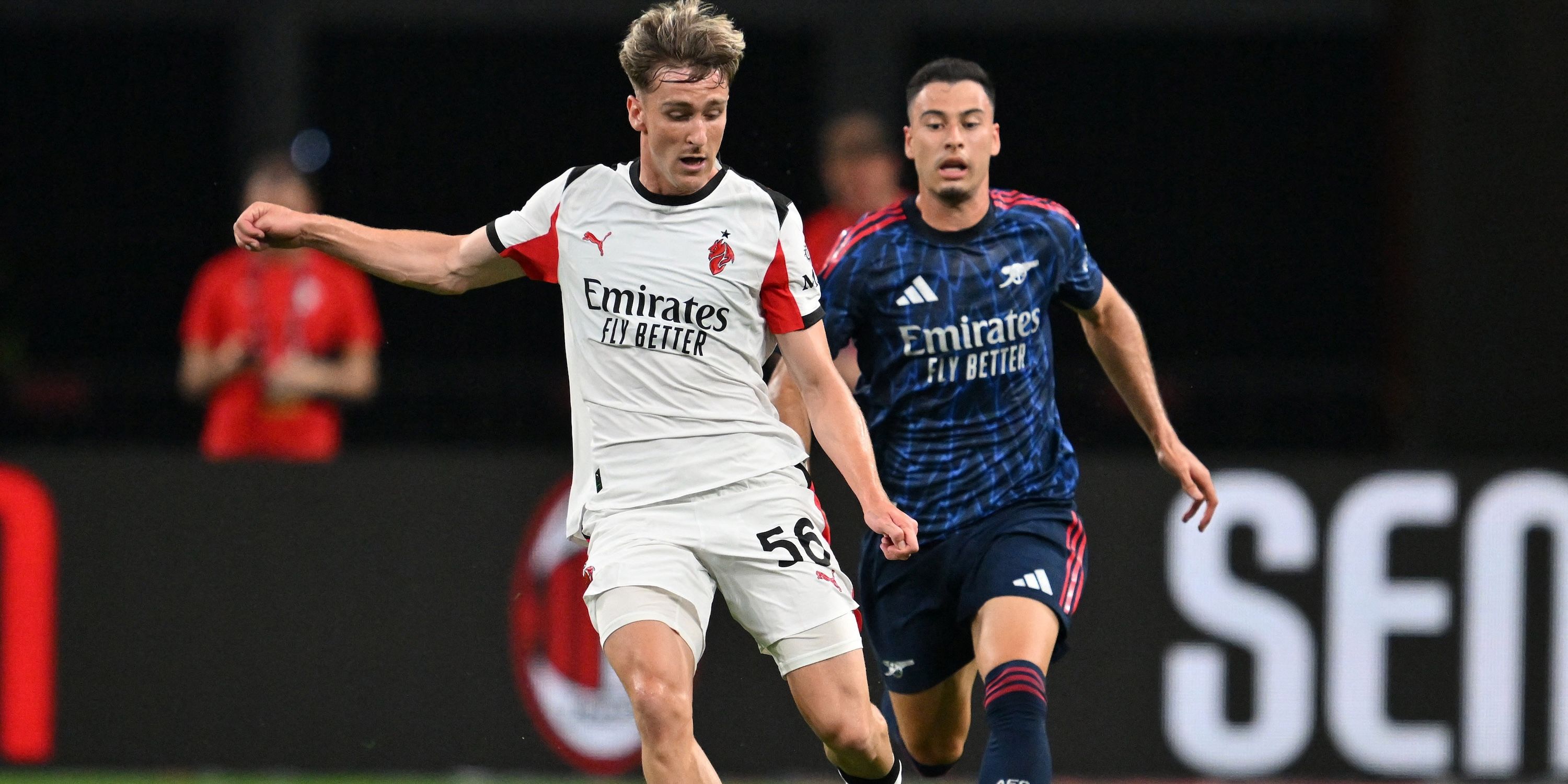 Alexis Saelemaekers of AC Milan in action with Gabriel Martinelli d'Arsenal
