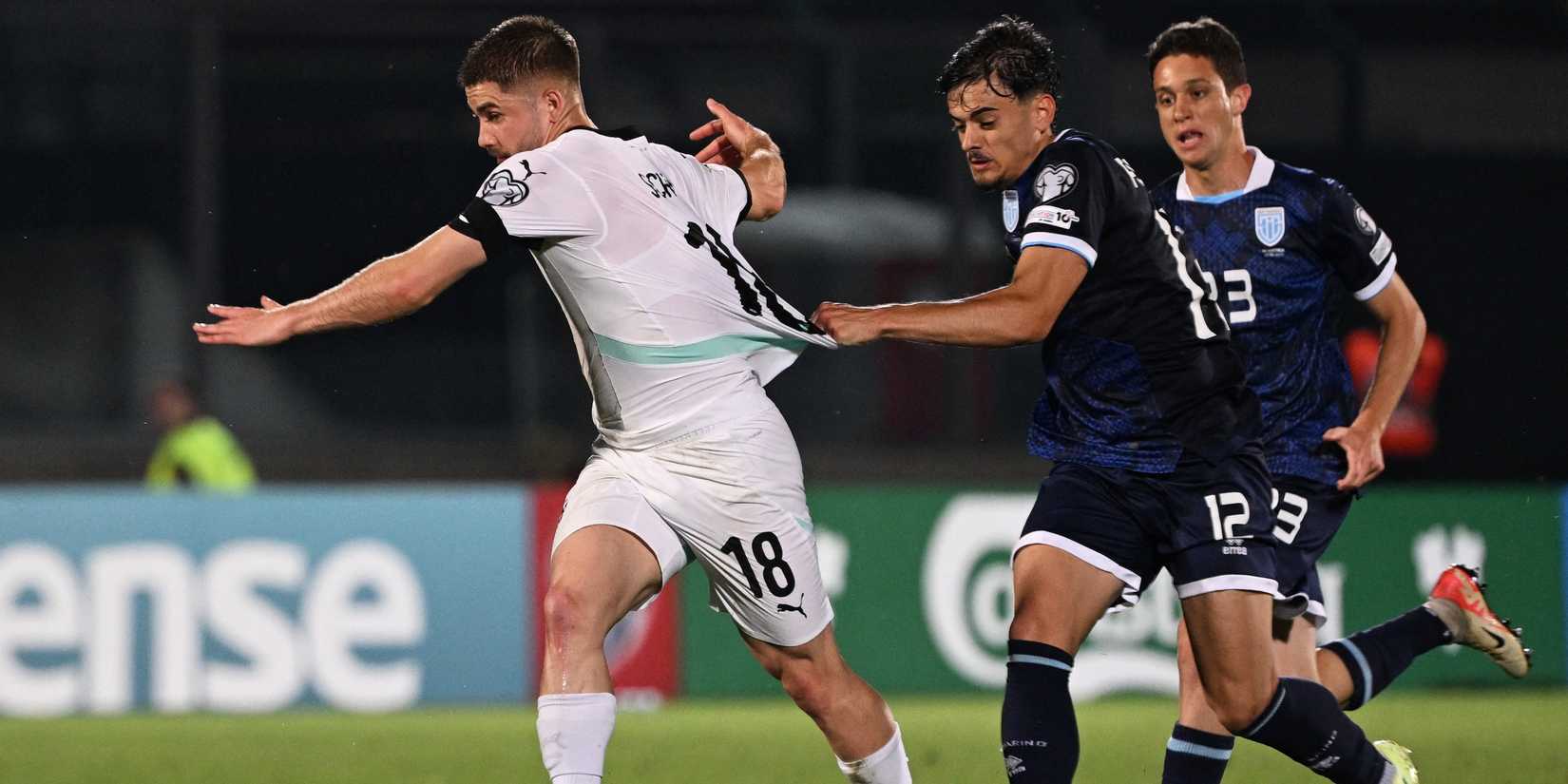 Austria's Romano Schmid in action with San Marino's Alberto Riccardi