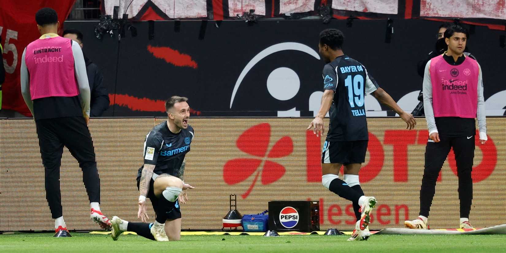    Aleix Garcia celebrates Bayer Leverkusen to score his fourth goal with Nathan Tila