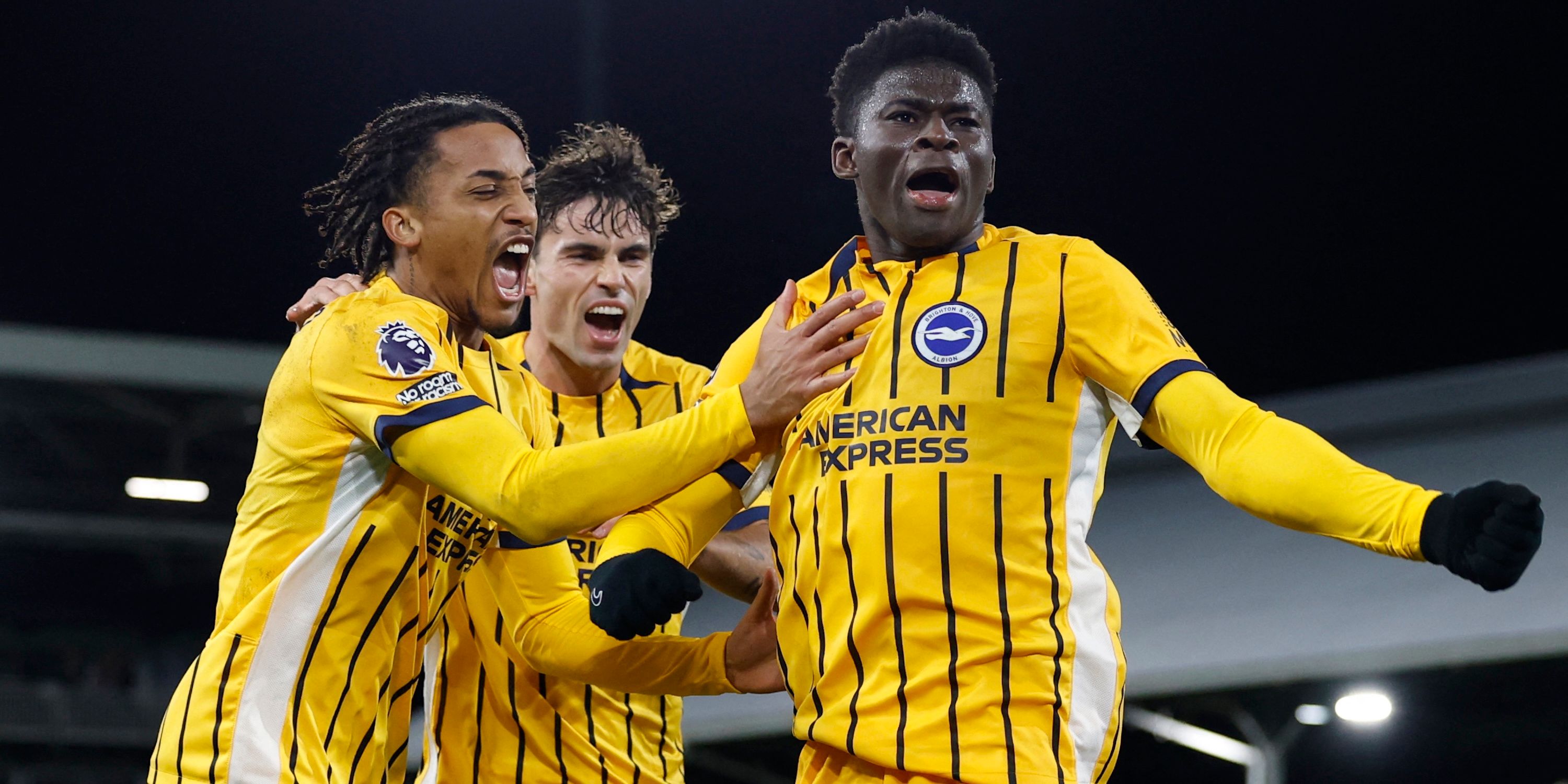 Carlos Baleba de Brighton & Hove Albion celebrates their first goal with Joao Pedro and Matt O'riley