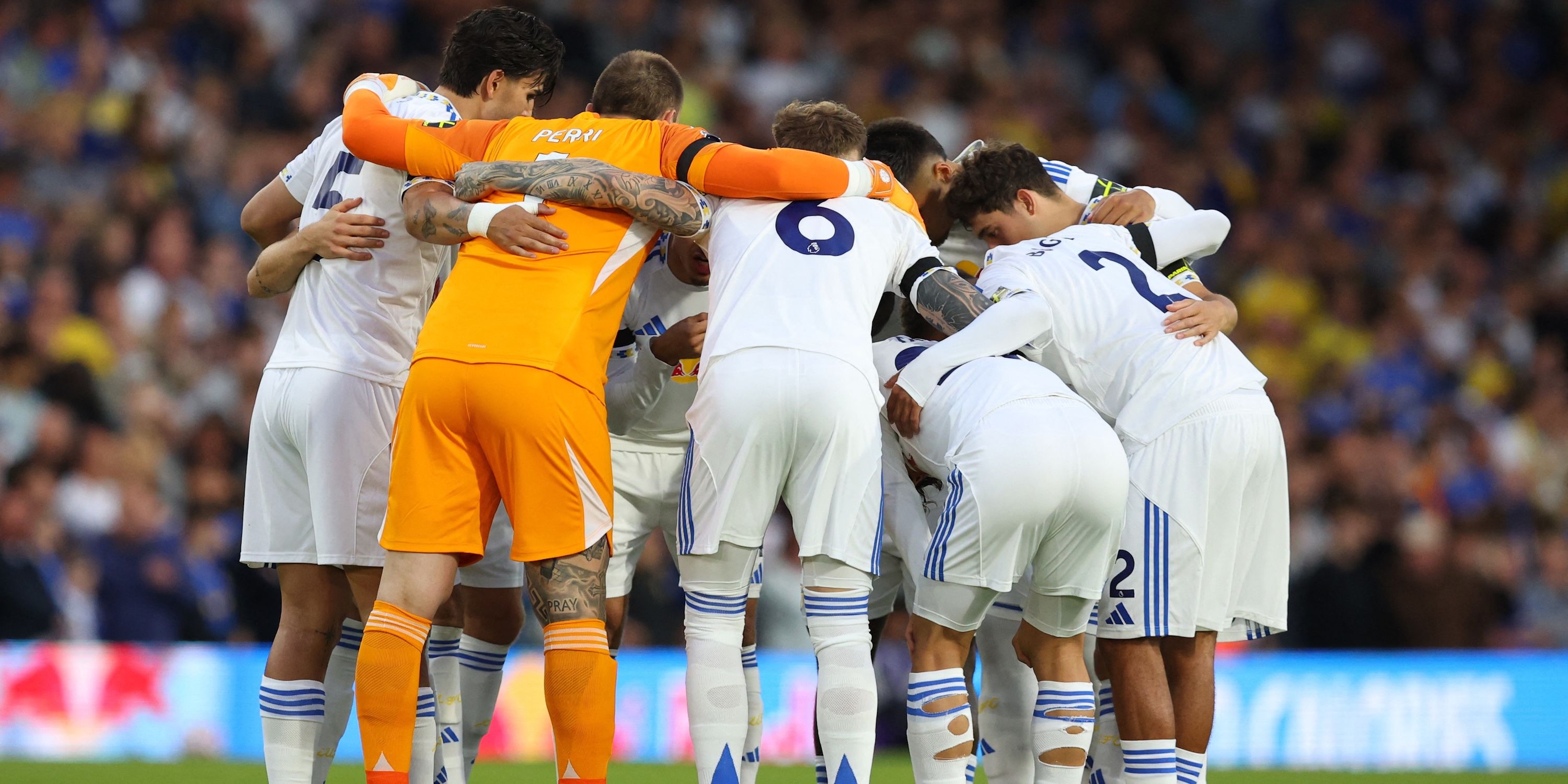 Leeds United players huddle before the match