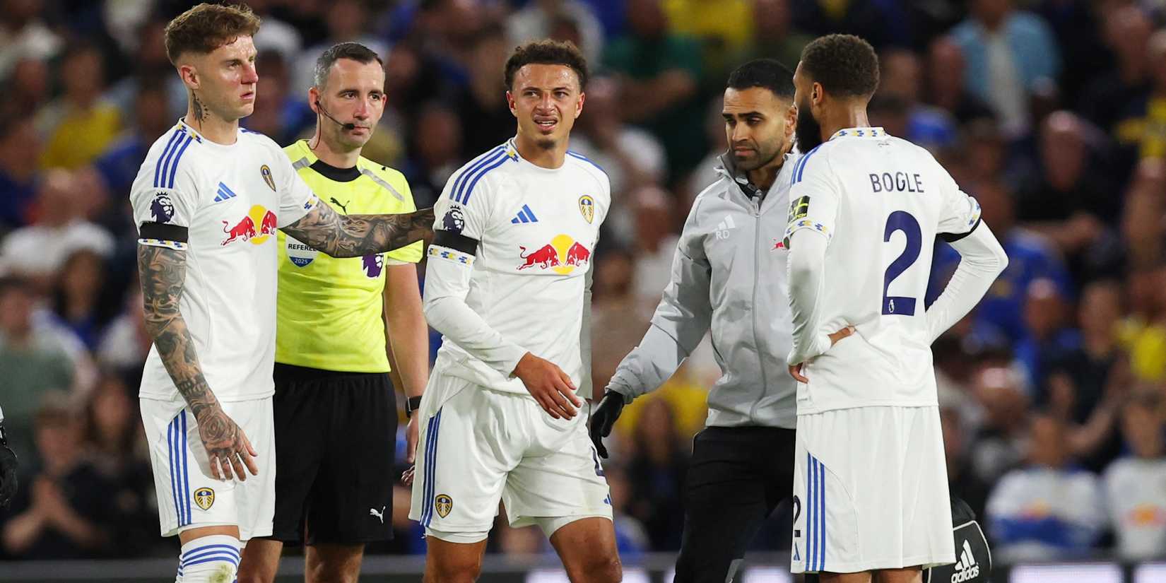 Leeds United's Ethan Ampadu with Joe Rodon and Jayden Bogle after he receives medical attention