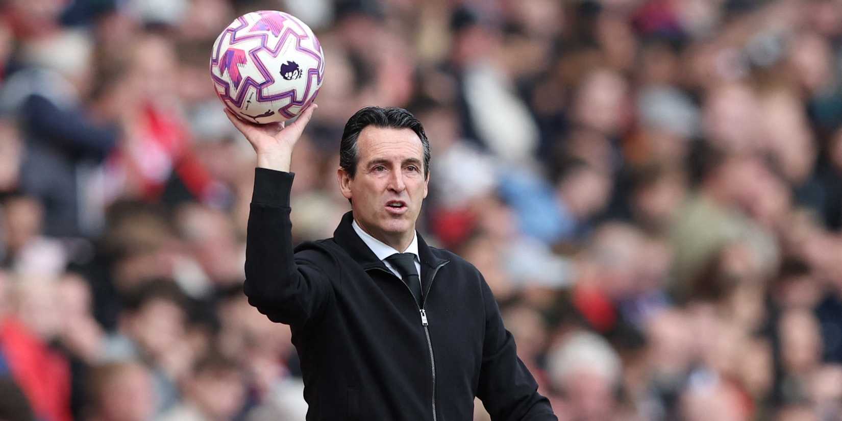 Aston Villa coach Unai Emery holds the match ball 