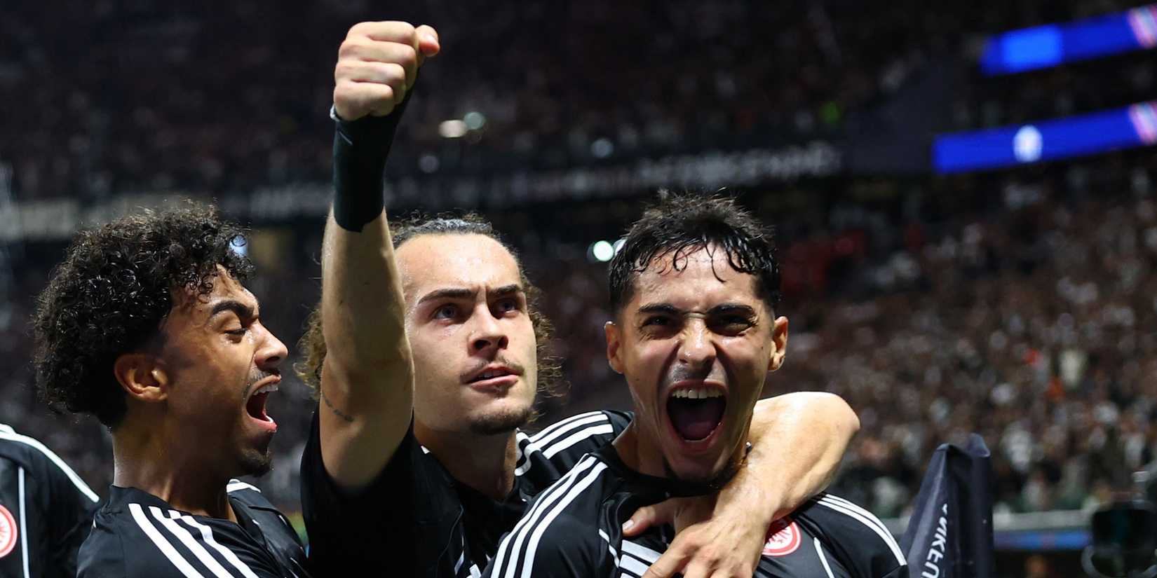 Eintracht Frankfurt's Chaibi, Arthur Theate and Nathaniel Brown celebrate