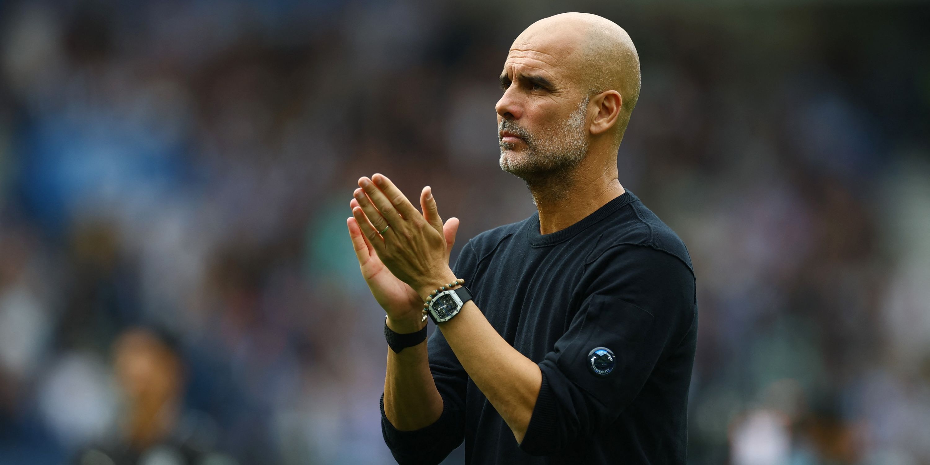 Manchester City manager Pep Guardiola looks dejected as he applauds fans after the match 