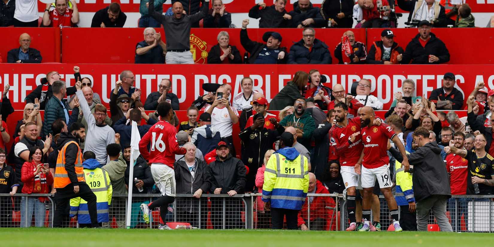 Manchester United player Brian Mbumo celebrates his second goal with his teammate Bruno Fernandez and Emad Diallo