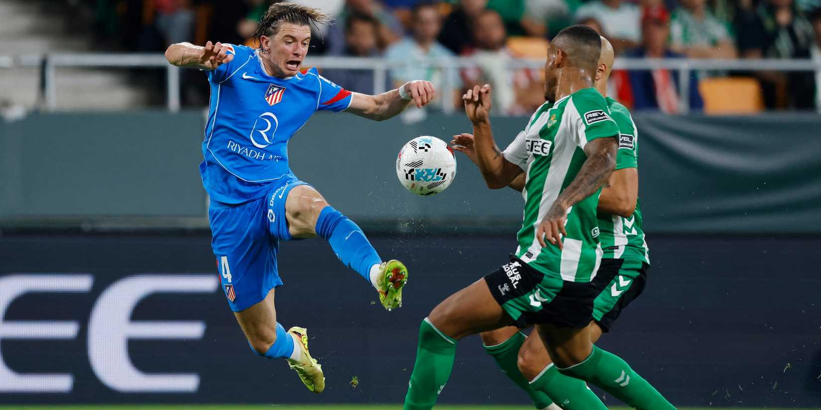 Atletico Madrid's Conor Gallagher in action with Real Betis' Natan and Sofyan Amrabat