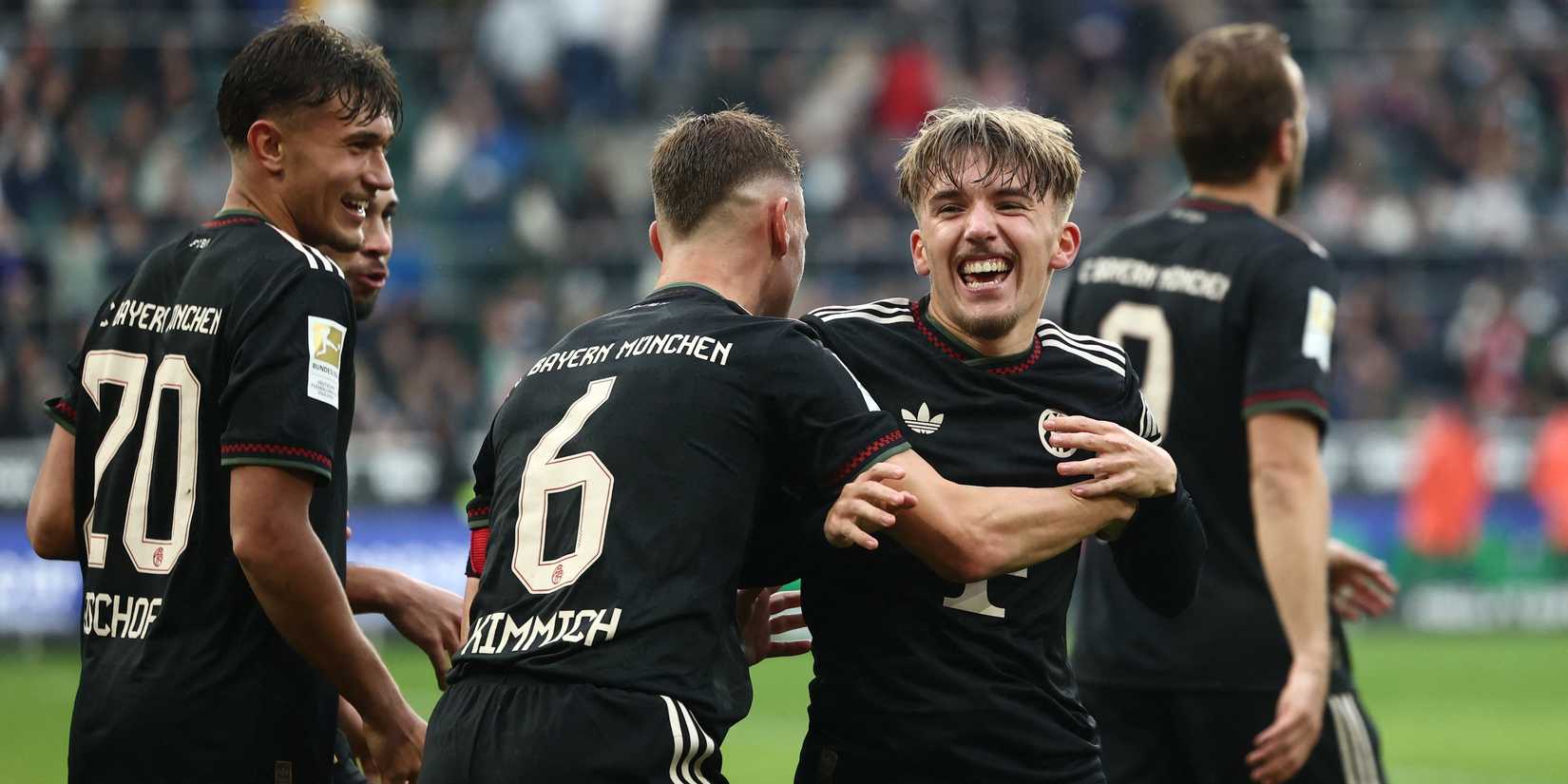 Bayern Munich's Lennart Karl celebrates scoring their third goal with Joshua Kimmich 