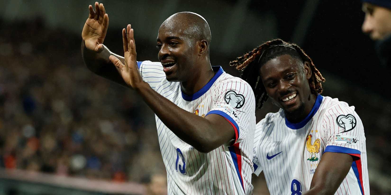 France's Jean-Philippe Mata celebrates his second goal with Manu Koon