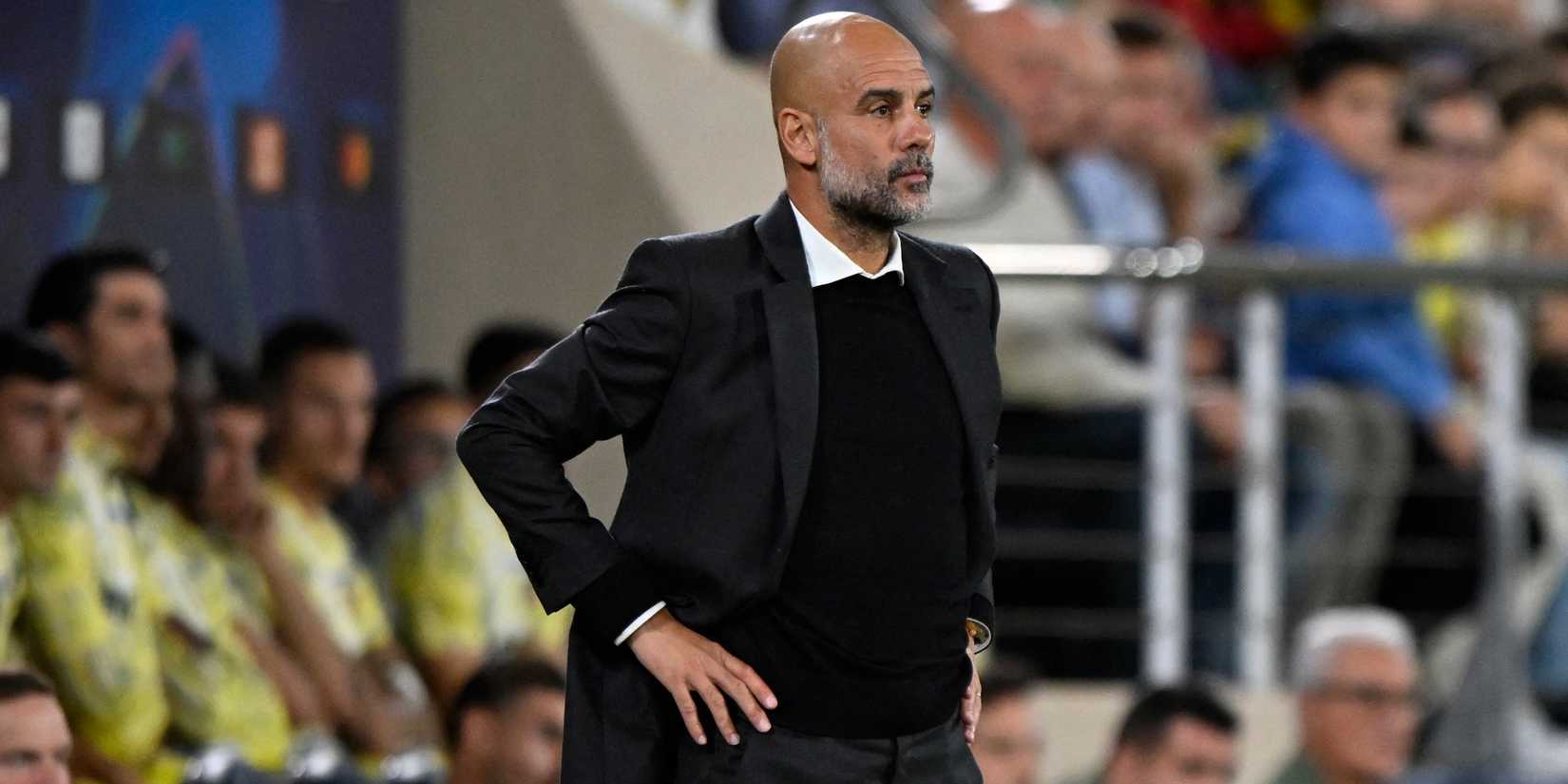 Manchester City manager Pep Guardiola looks on 