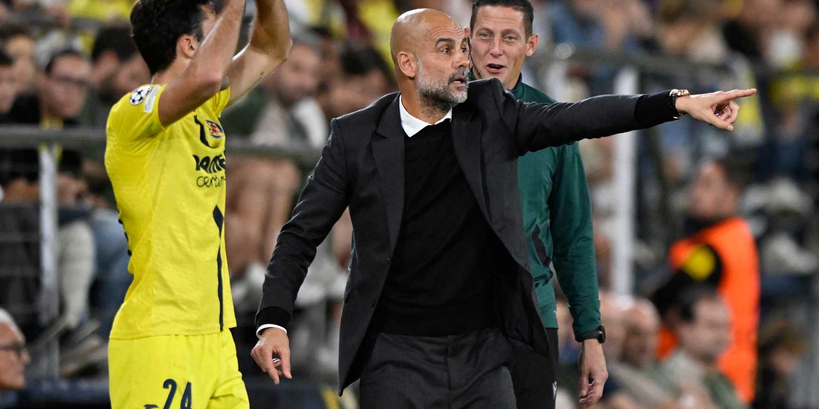 Manchester City manager Pep Guardiola reacts as Villarreal's Alfonso Pedraza prepares to take a throw
