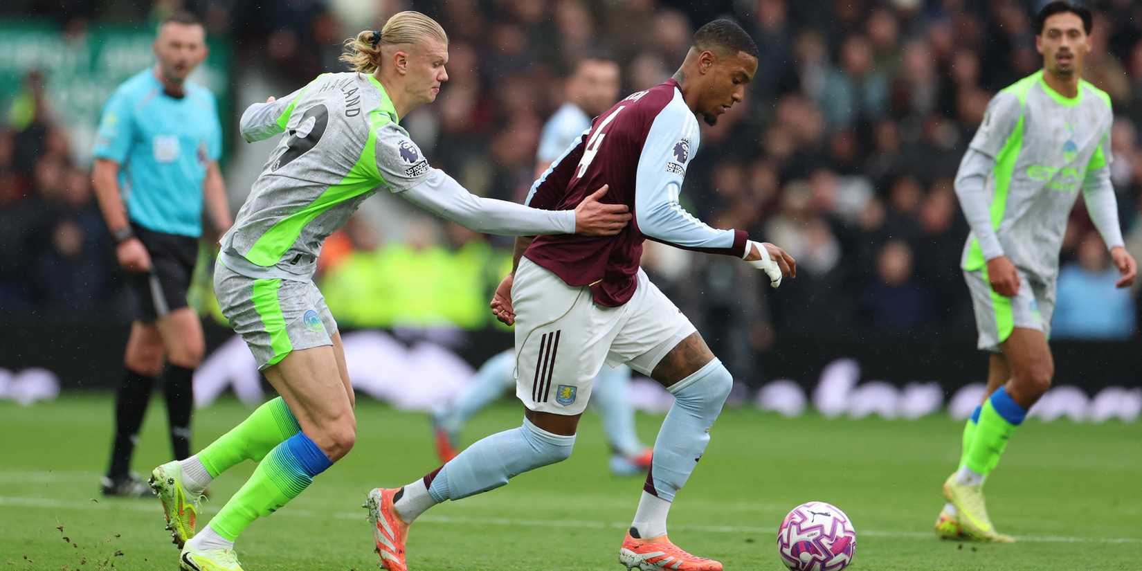 Manchester City's Erling Haaland in action with Aston Villa's Ezri Konsa