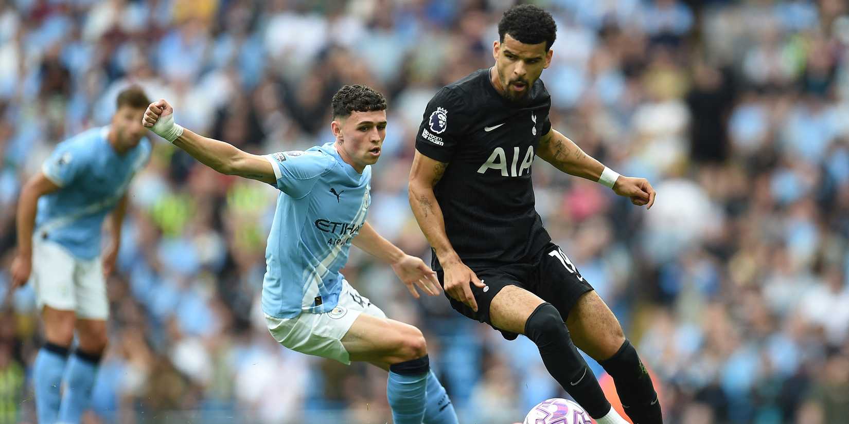 Manchester City's Phil Foden in action with Tottenham Hotspur's Dominic Solanke 